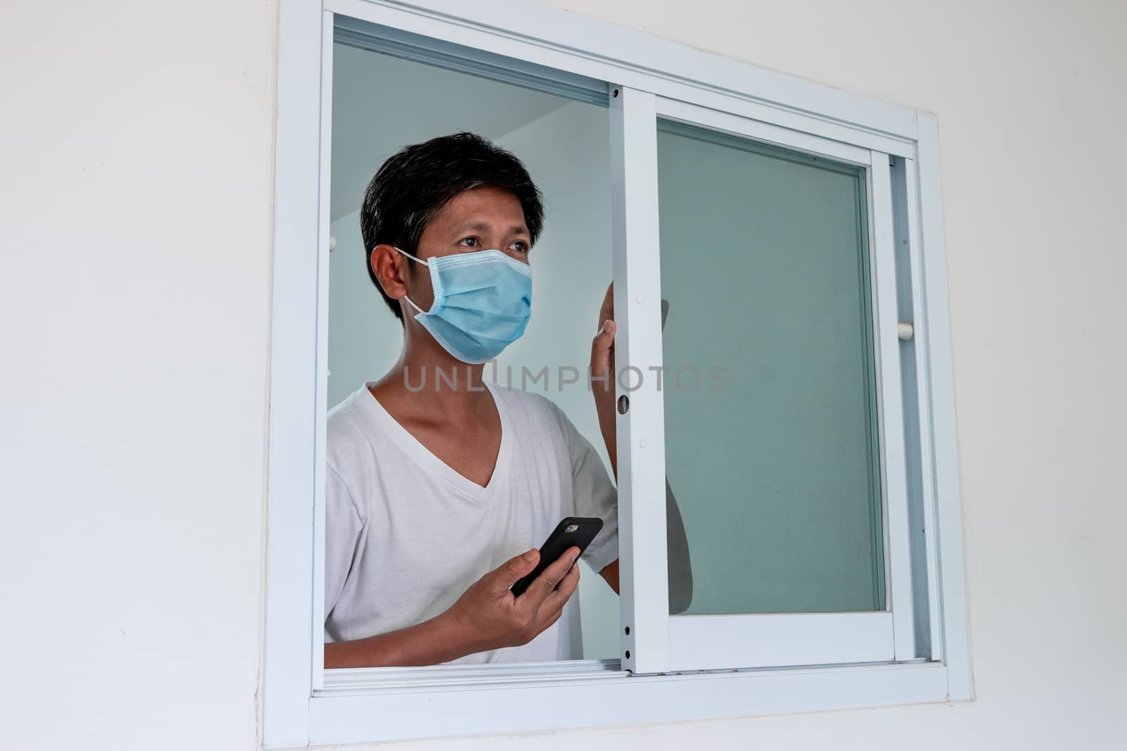 Man in isolation at home for coronavirus outbreak (COVID-19), Quarantine to prevent the spread of the coronavirus (COVID-19)