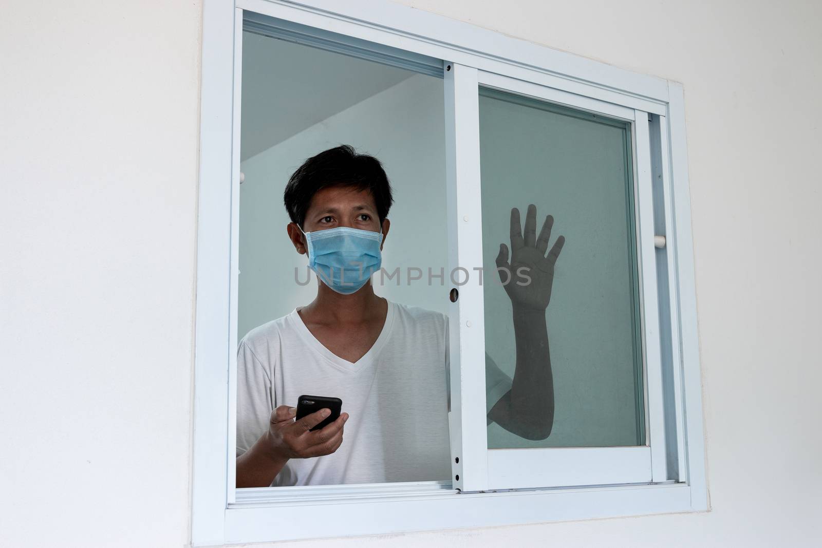 Man in isolation at home for coronavirus outbreak (COVID-19), Quarantine to prevent the spread of the coronavirus (COVID-19)