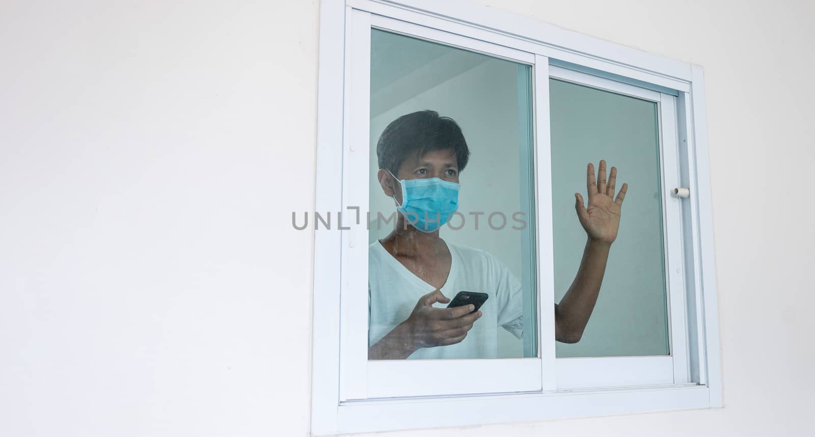 Man in isolation at home for coronavirus outbreak (COVID-19), Quarantine to prevent the spread of the coronavirus (COVID-19)