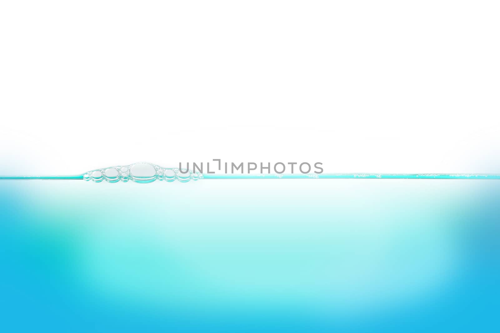 Water with bubbles of air, green and blue clean fresh white background 