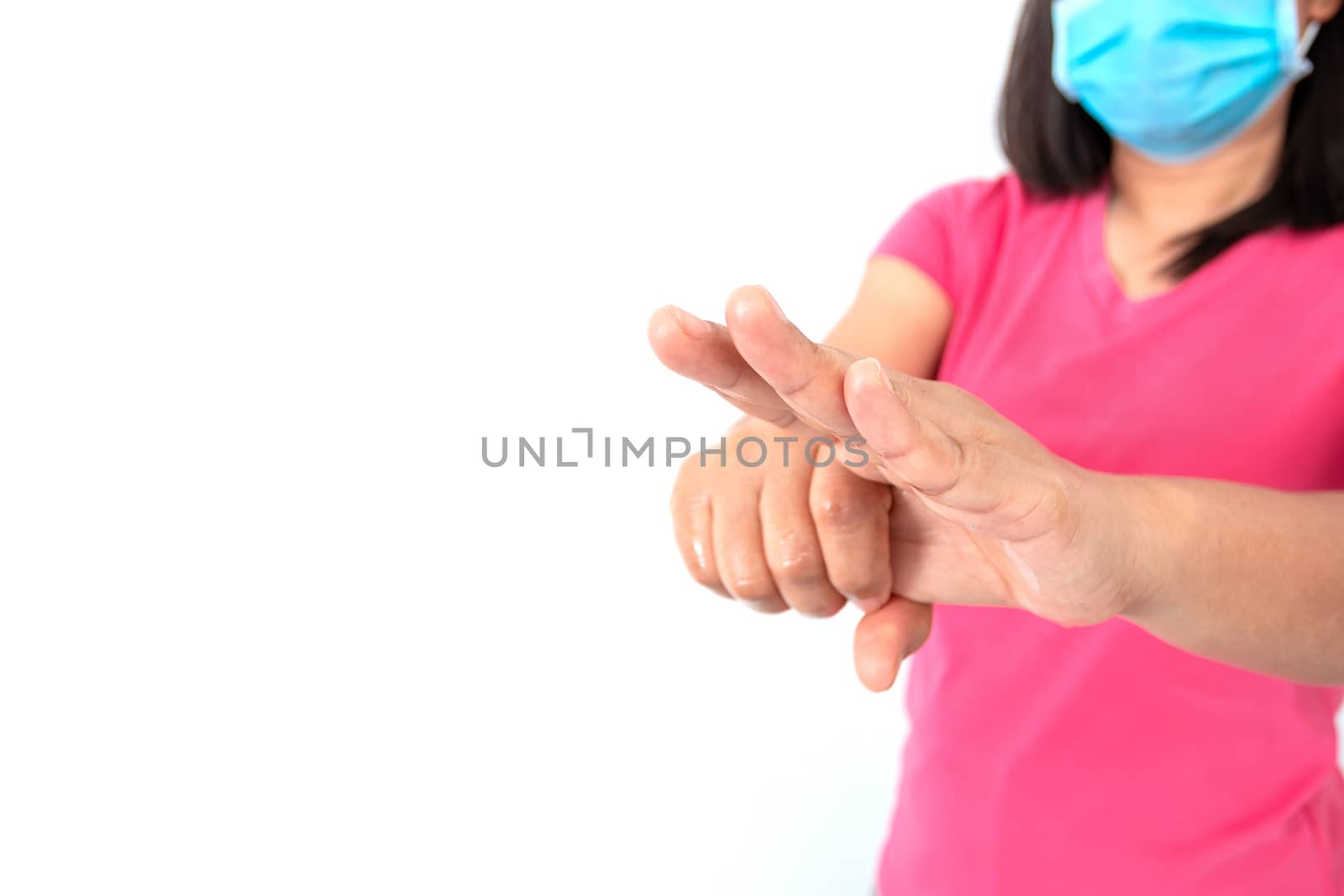 During the coronavirus (COVID-19) epidemic, A woman washing her hands with alcohol gel isolated on white background