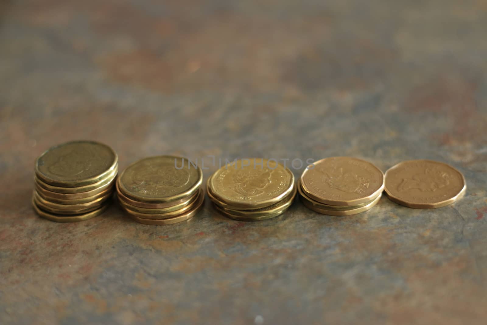 Canadian coins. Pile of Canadian dollar coins aka loonies by mynewturtle1