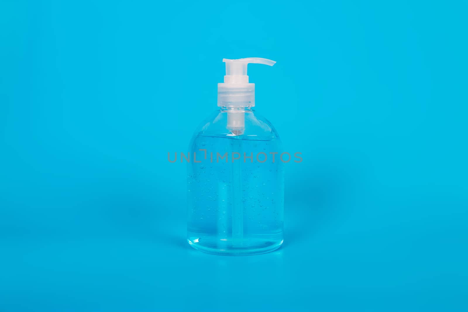 Alcohol gel Sanitizer hand gel cleaners for anti Bacteria and virus on Blue Background, People using alcohol gel to wash hands to prevent Coronavirus (COVID-19)