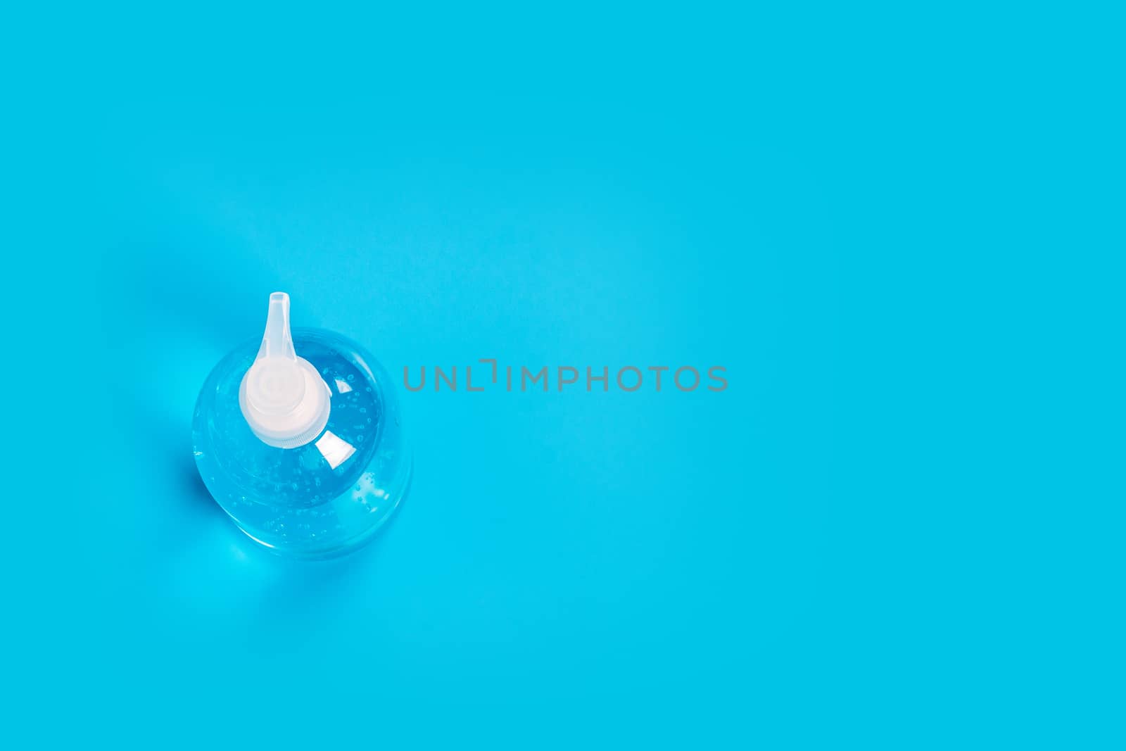 Alcohol gel Sanitizer hand gel cleaners for anti Bacteria and virus on Blue Background, People using alcohol gel to wash hands to prevent Coronavirus (COVID-19)