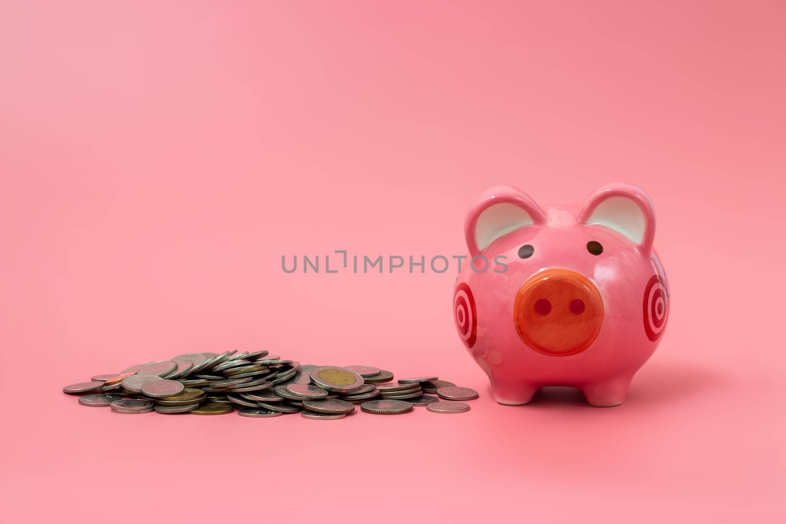 Pink piggy bank on pastel pink background, Financial concepts