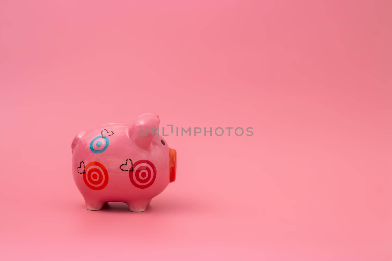 Pink piggy bank on pastel pink background, Financial concepts