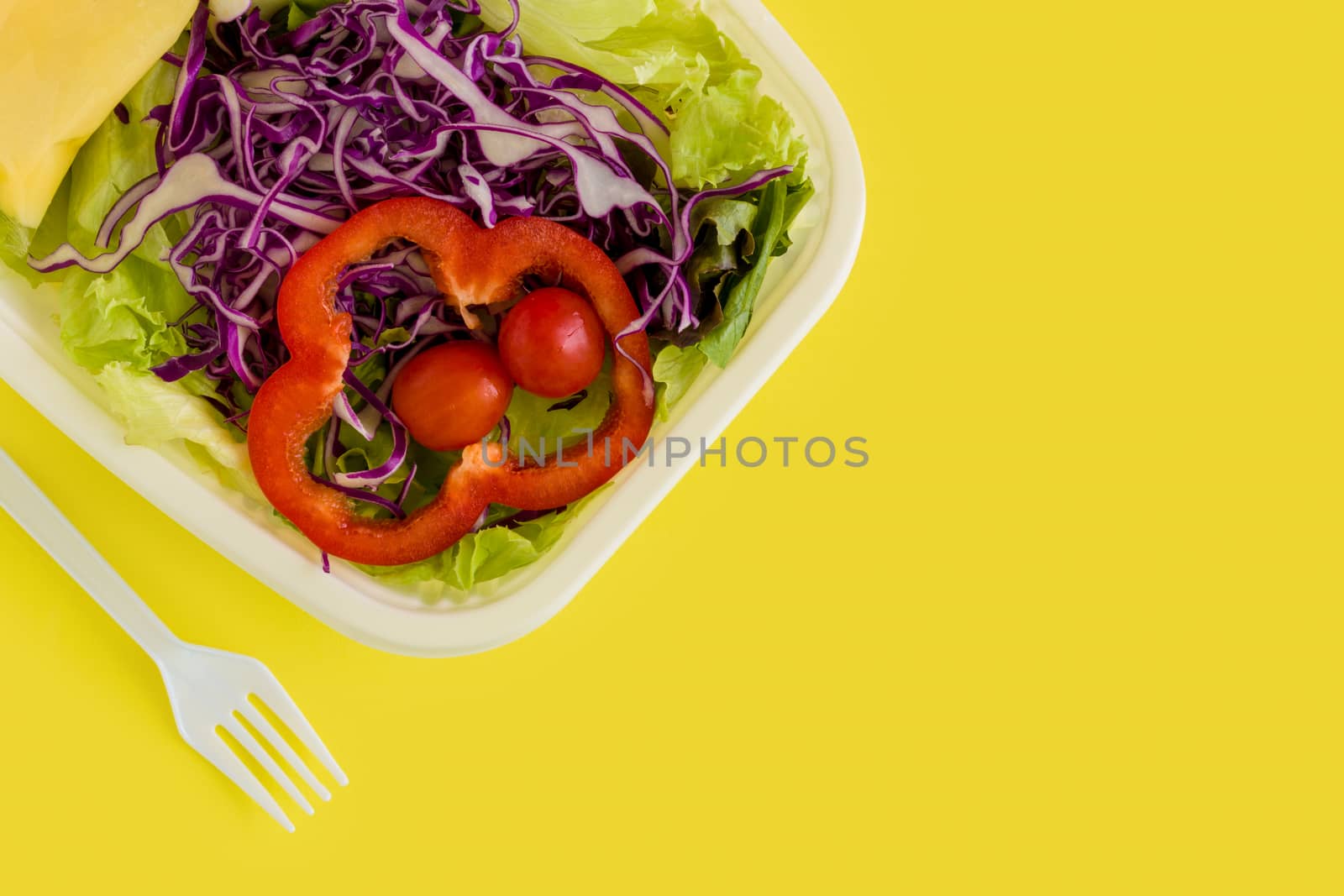Fresh salad in plastic box ready for takeaway.