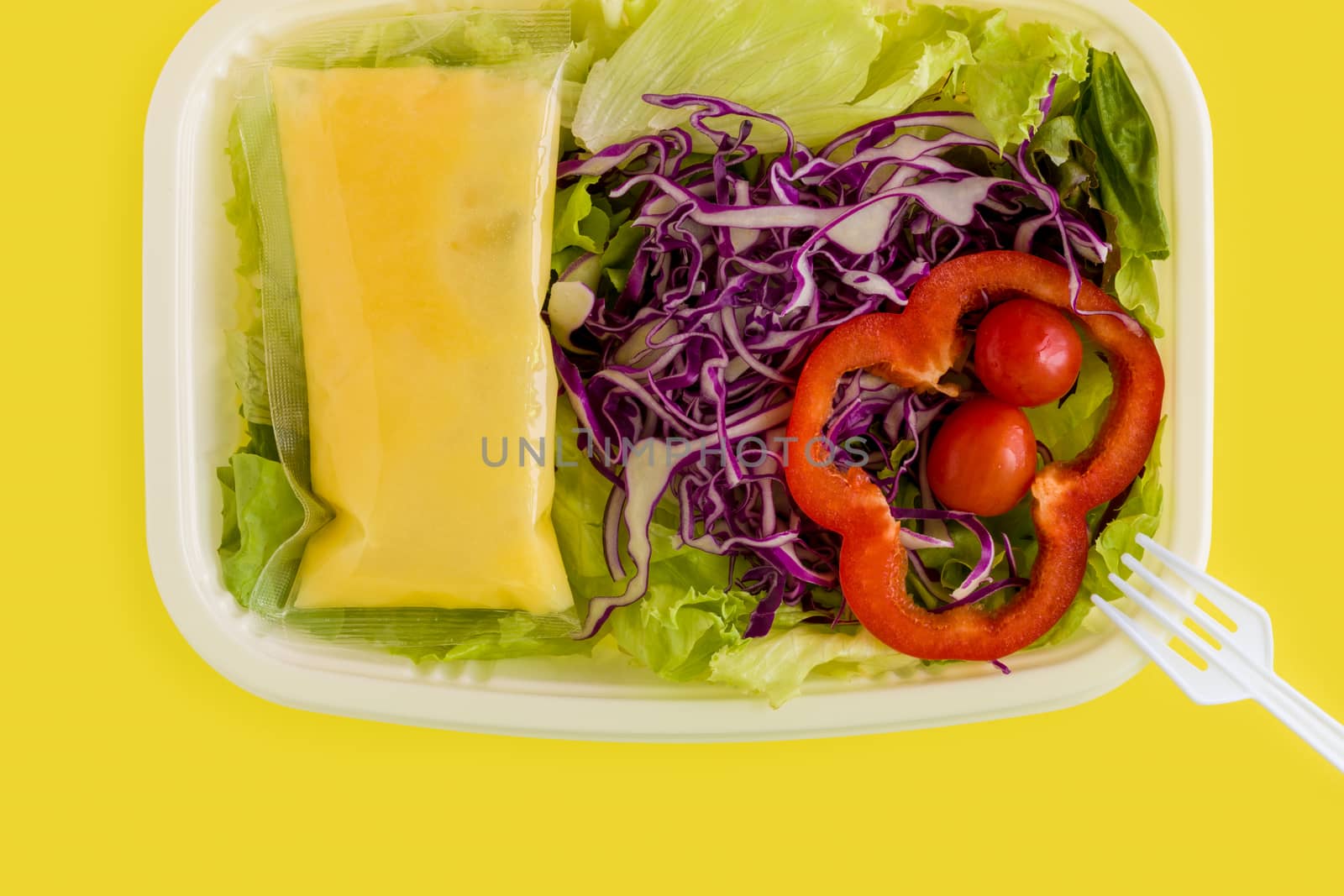 Fresh salad in plastic box ready for takeaway.