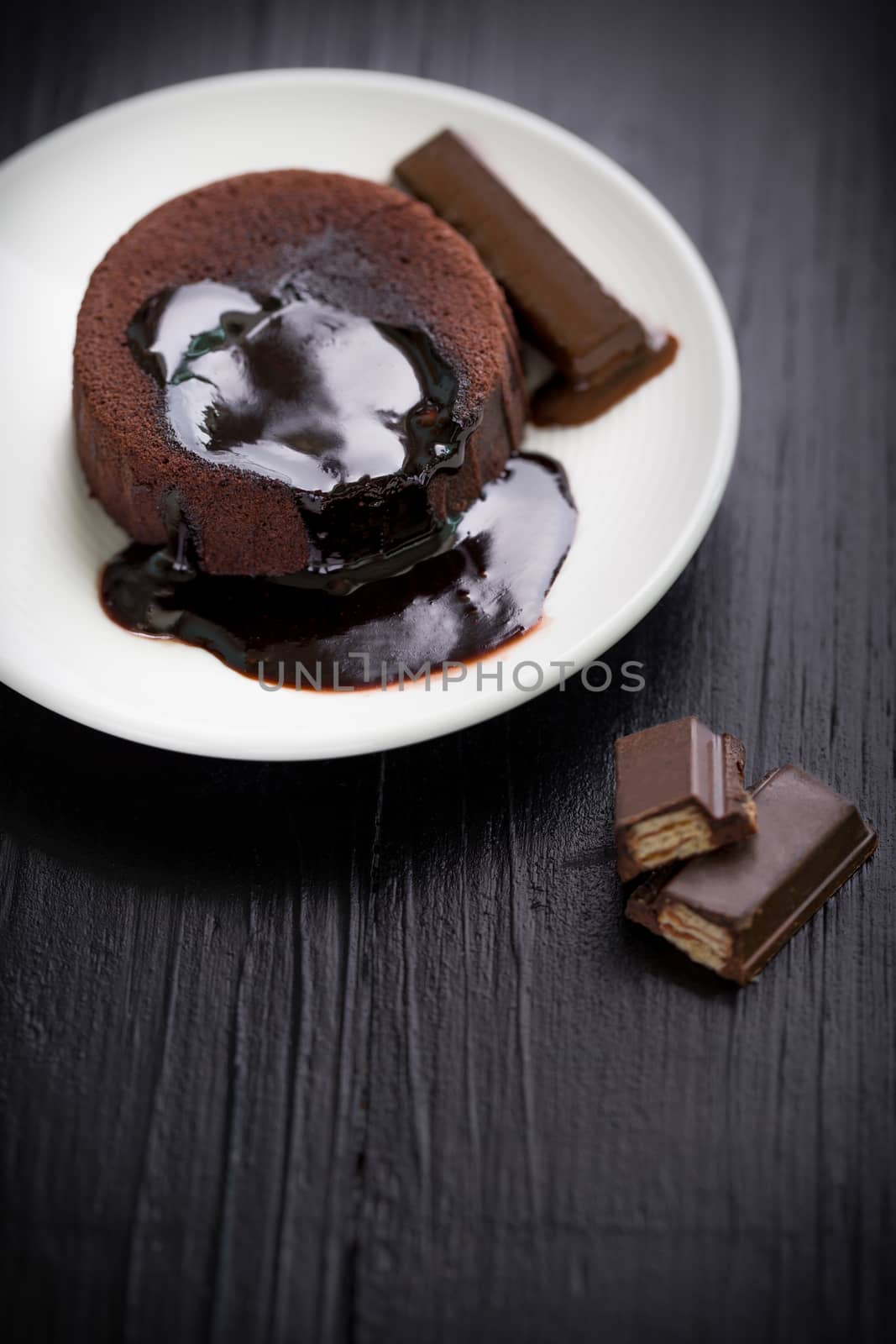 Chocolate lava cake with melting chocolate sauce.