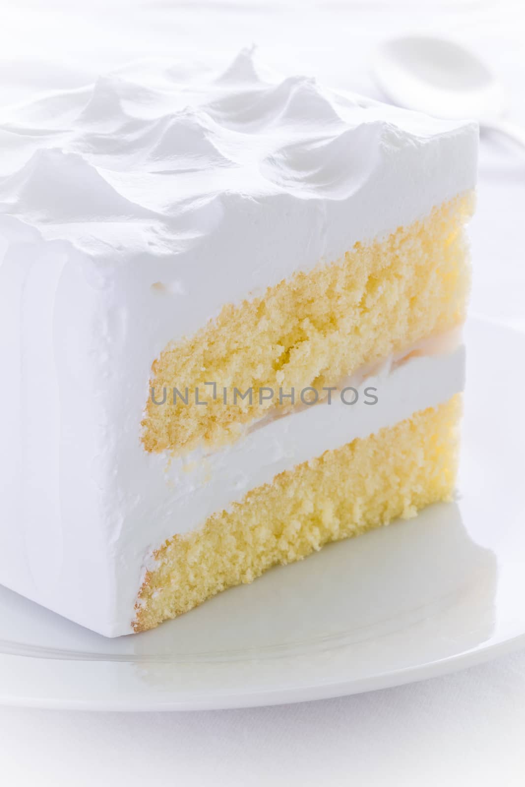 White cake for tea break moment on white background.