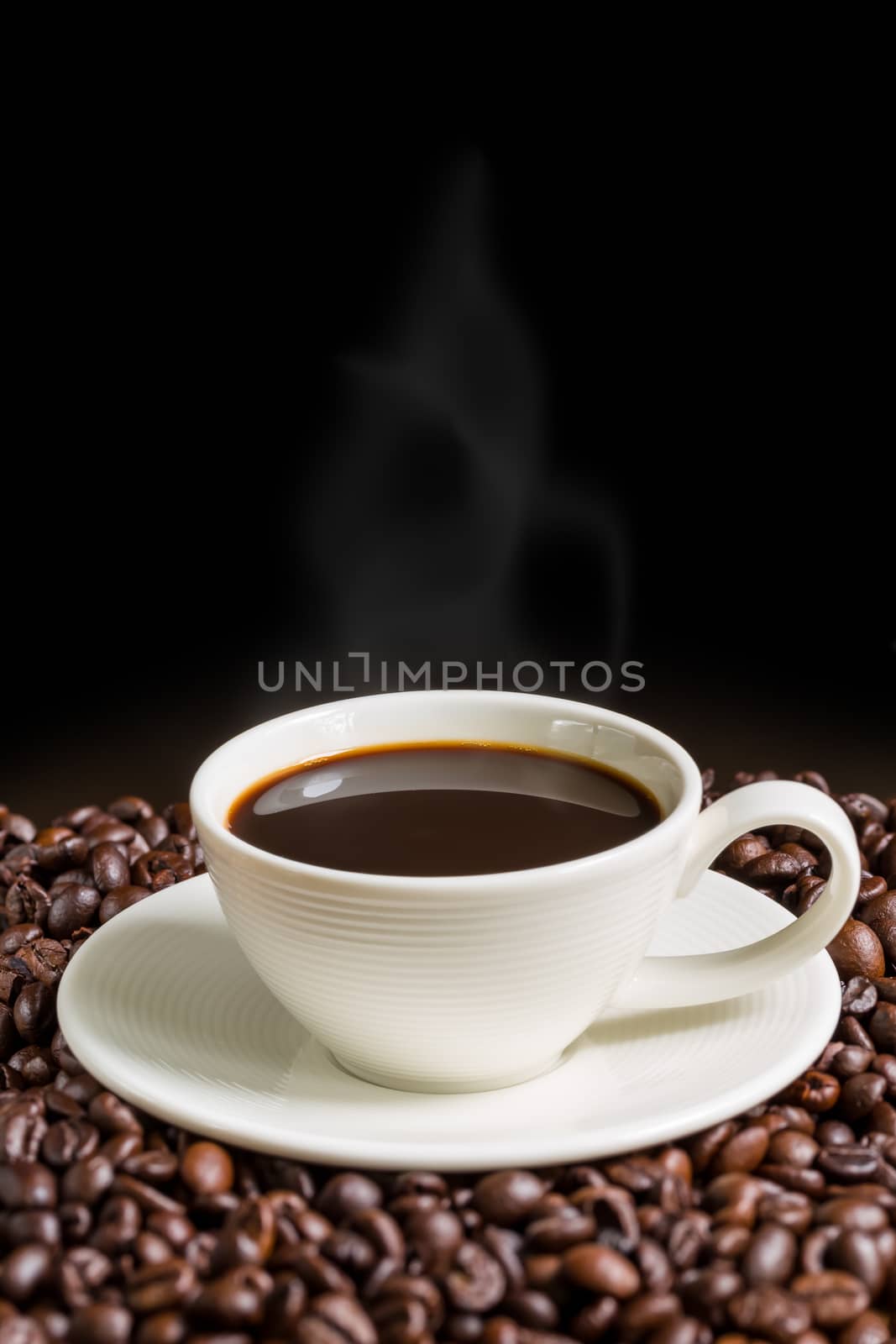 Warm coffee in white cup for relaxing moment.