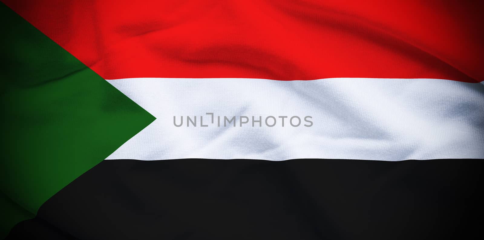 Wavy and rippled national flag of Sudan background.