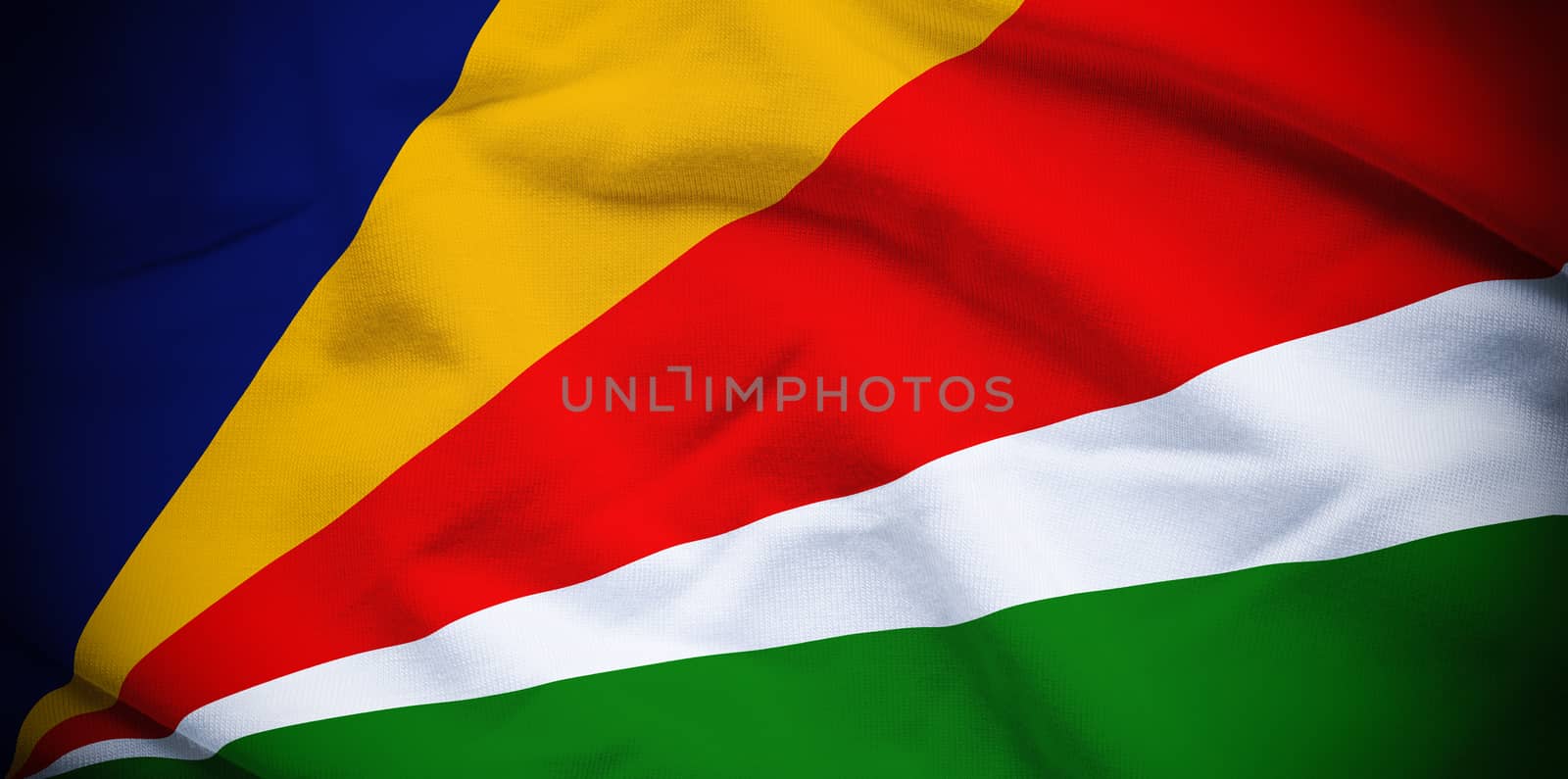 Wavy and rippled national flag of Seychelles background.