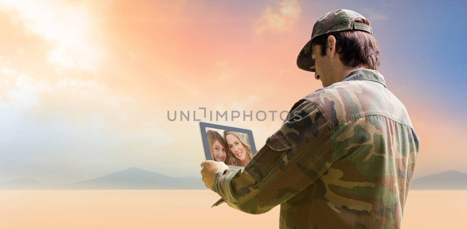 Composite image of army officer using tablet by Wavebreakmedia