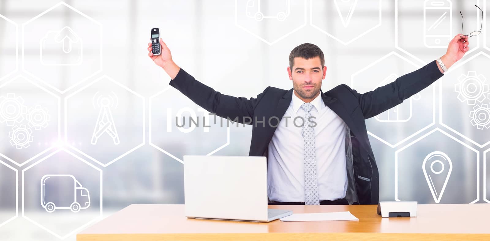 Businessman holding phone and glasses  against modern room overlooking city