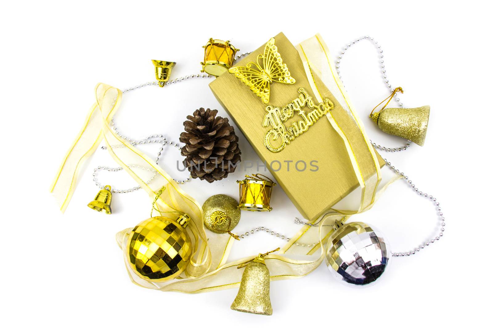 Christmas golden and silver decorations on white background. Greeting card on gift box.