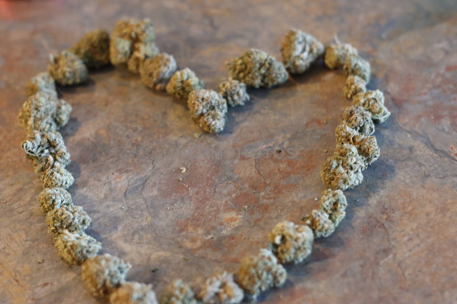 The shape of a heart made out of cannabis buds  by mynewturtle1