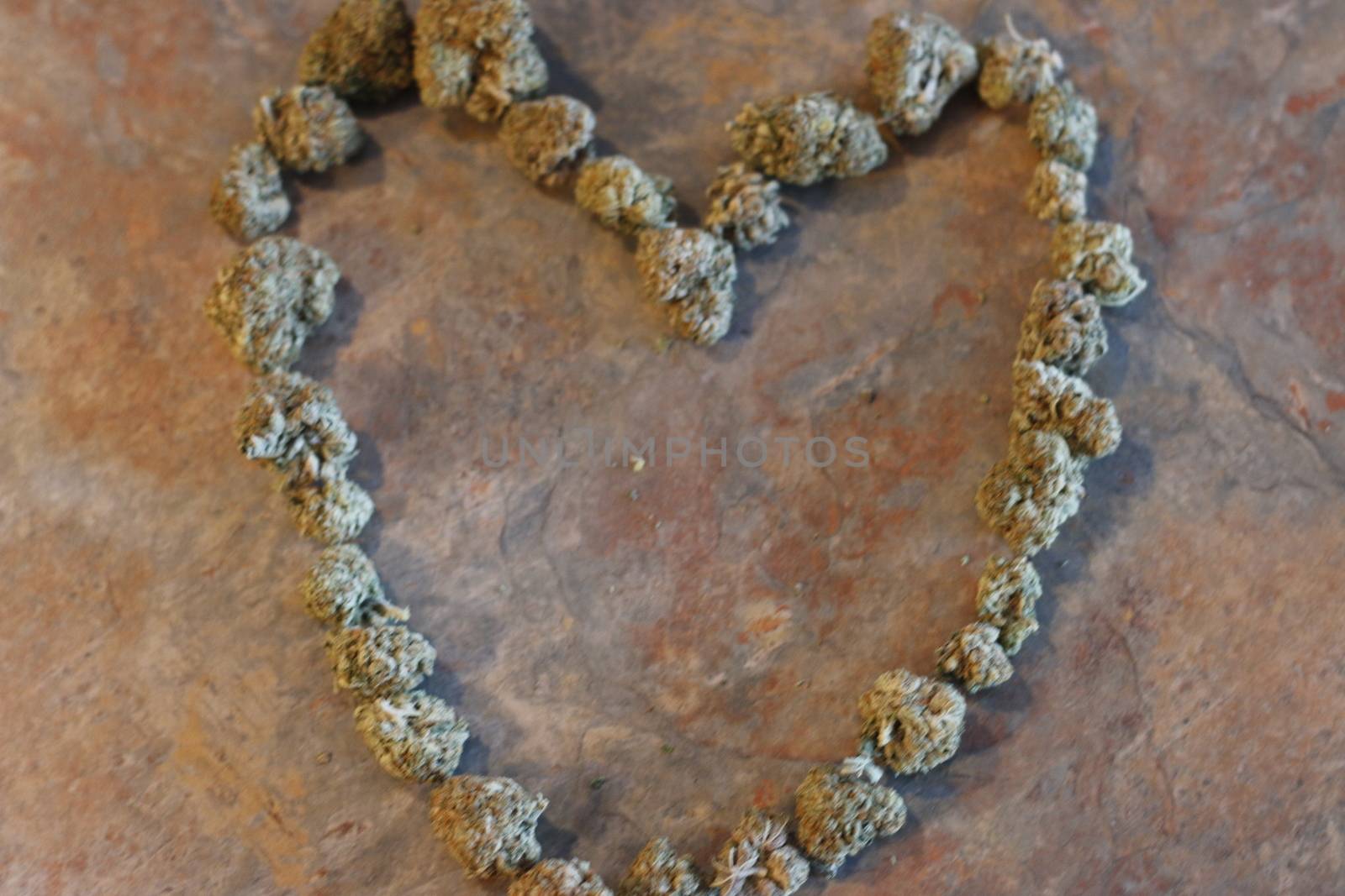 The shape of a heart made out of cannabis buds  by mynewturtle1