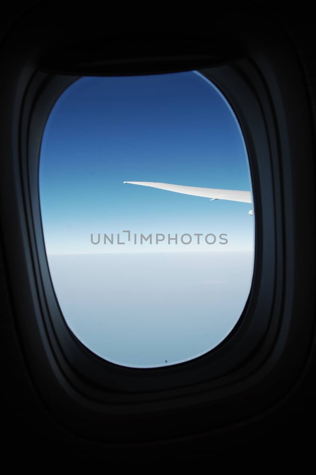 Aerial view of Clouds through flight window by rajastills