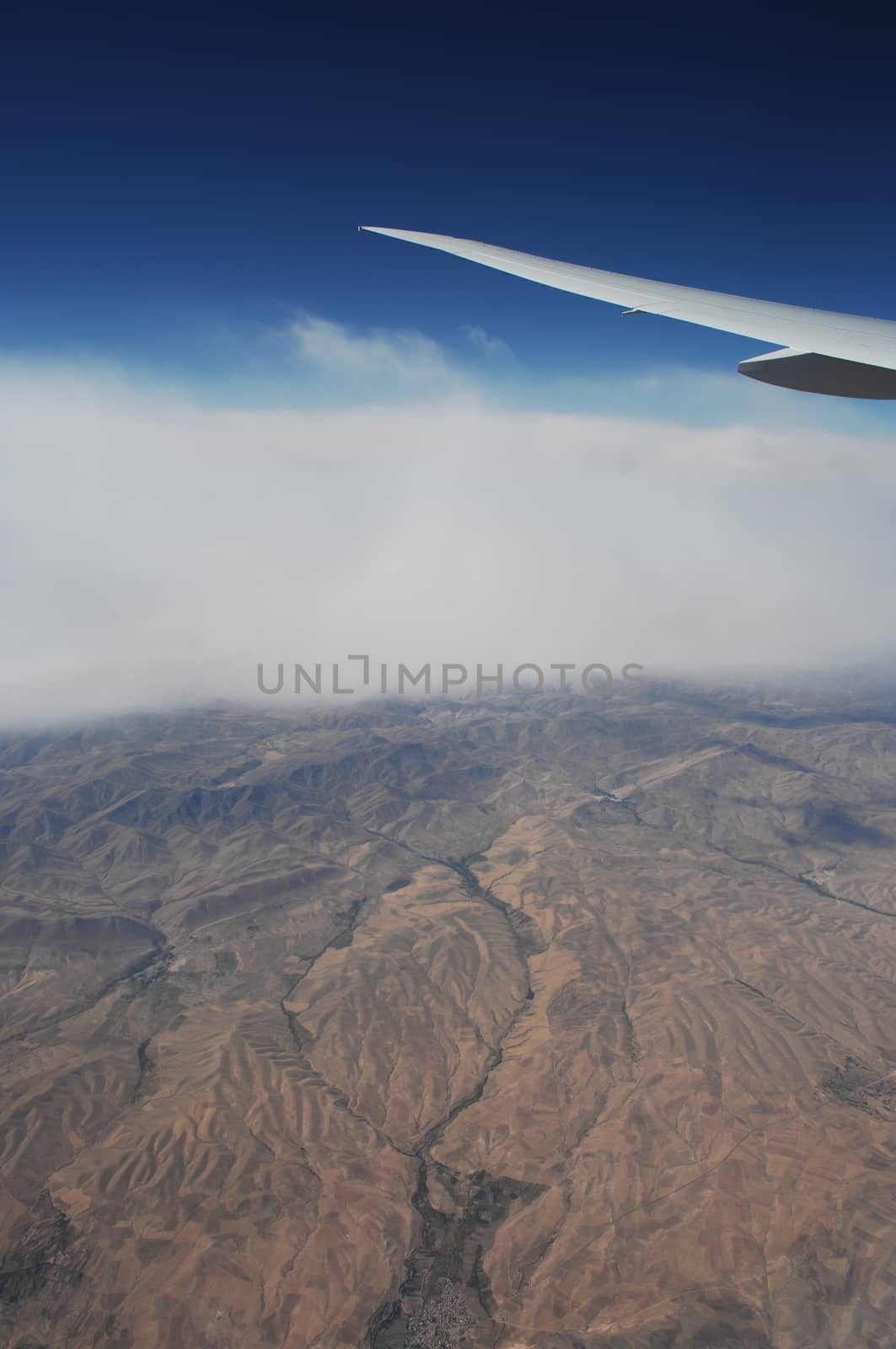 Aerial view of Clouds through flight window