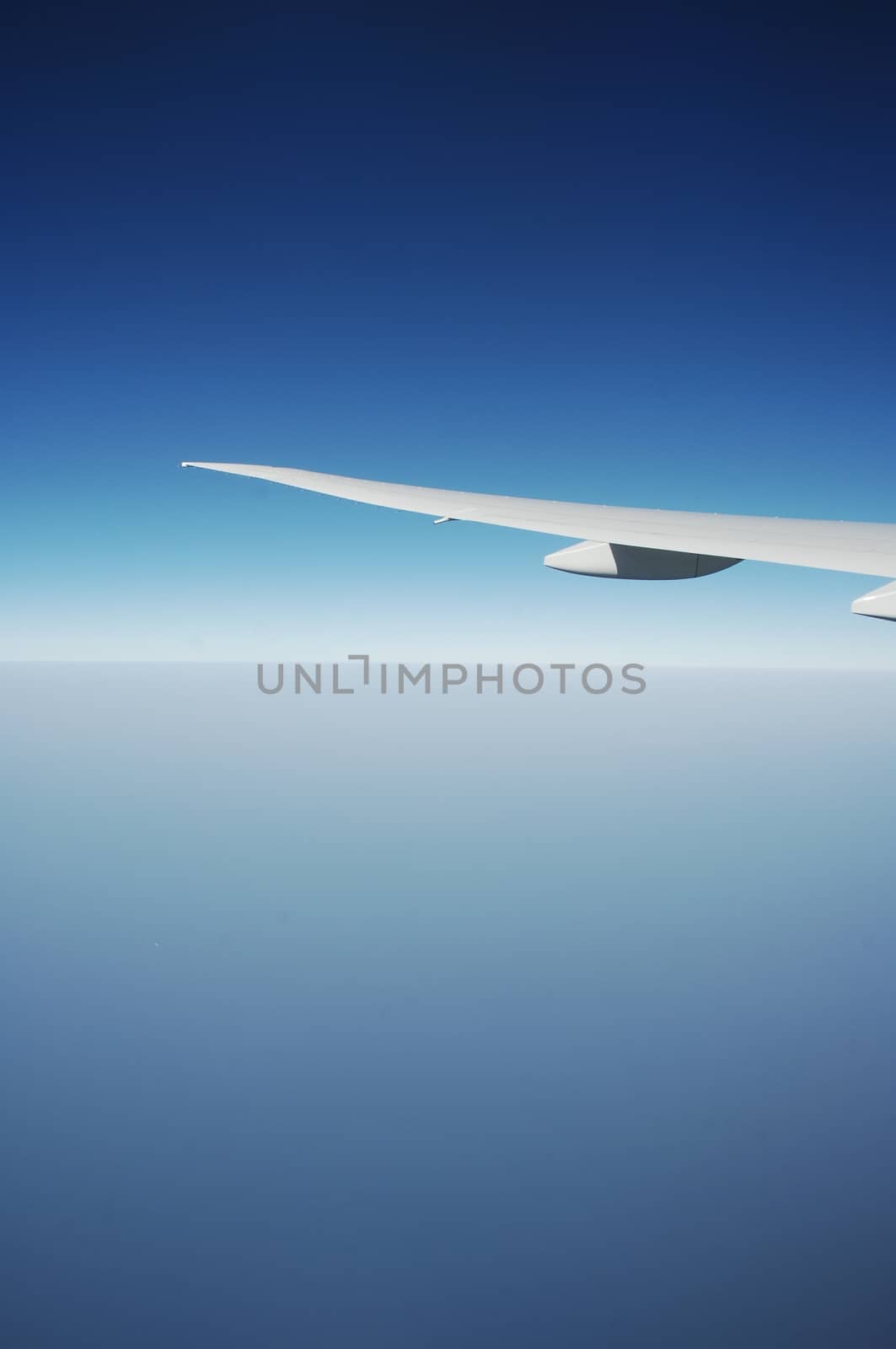 Aerial view of Clouds through flight window