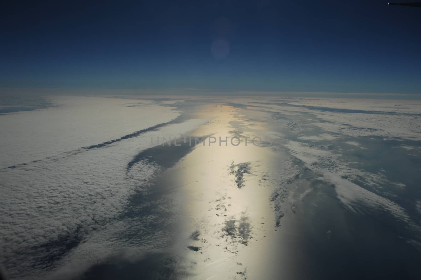 Aerial view of Clouds through flight window