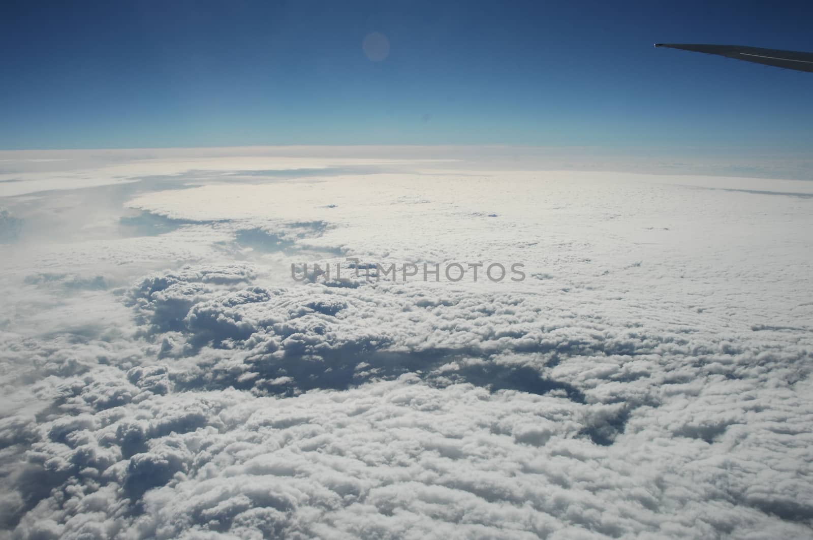 Aerial view of Clouds through flight window