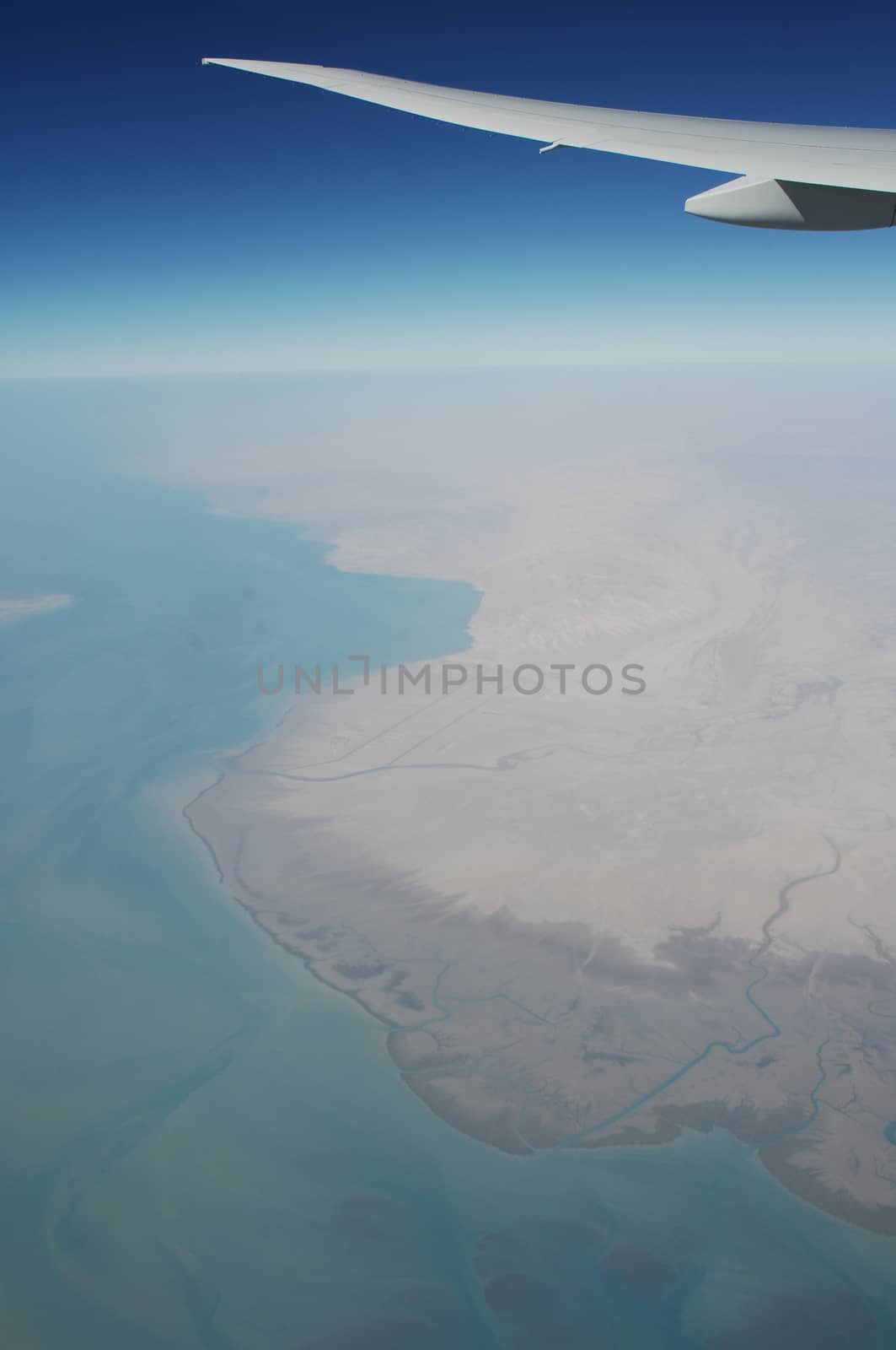 Aerial view of Clouds through flight window by rajastills