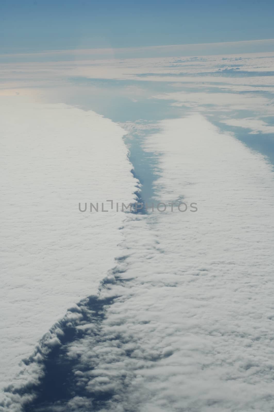 Aerial view of Clouds through flight window by rajastills