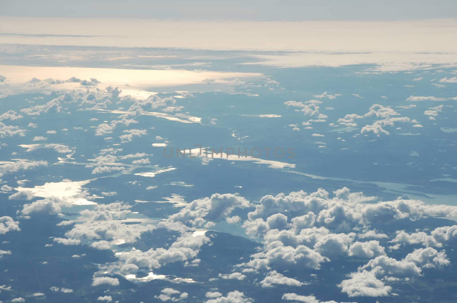 Aerial view of Clouds through flight window