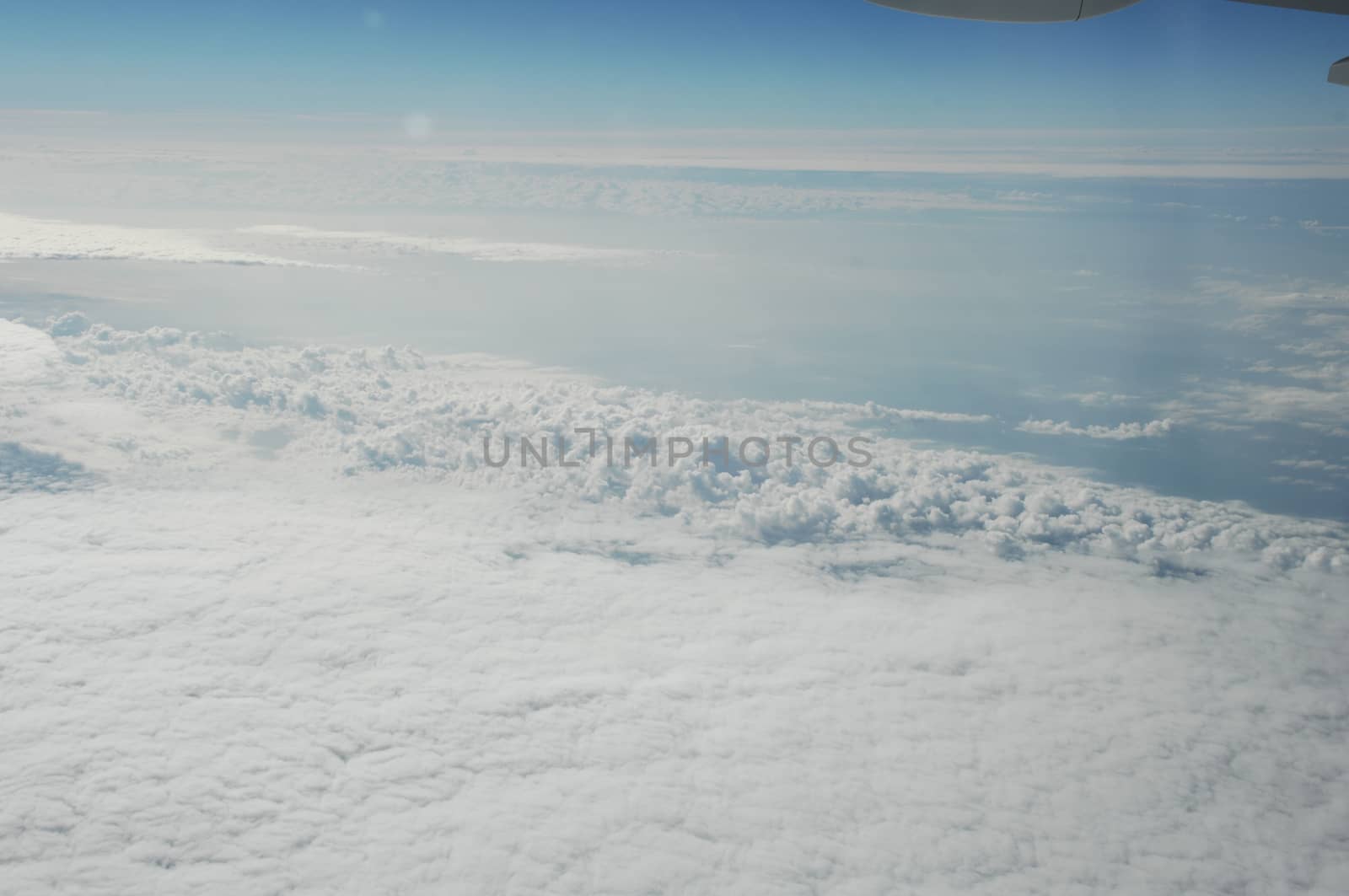 Aerial view of Clouds through flight window