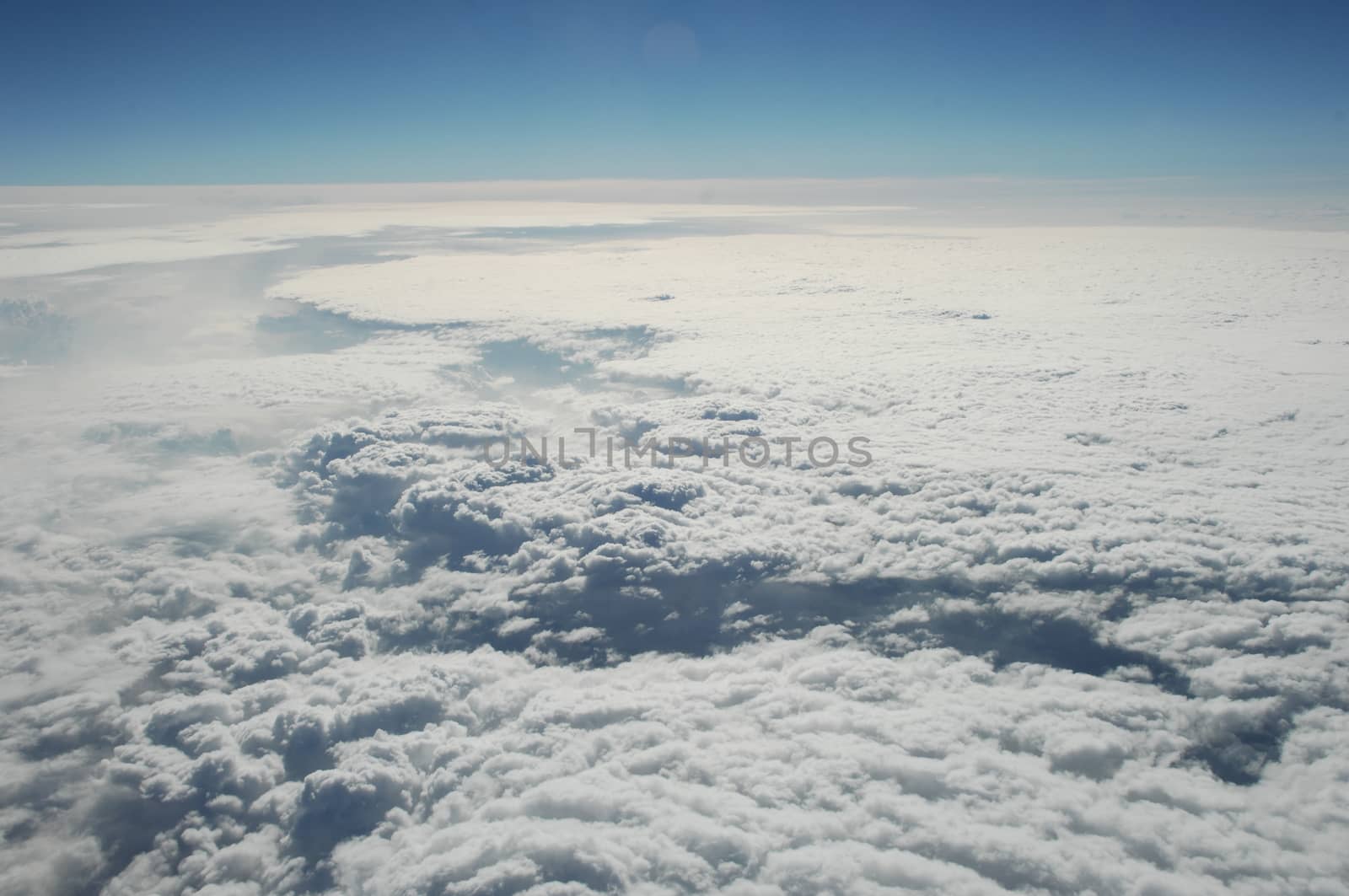 Aerial view of Clouds through flight window