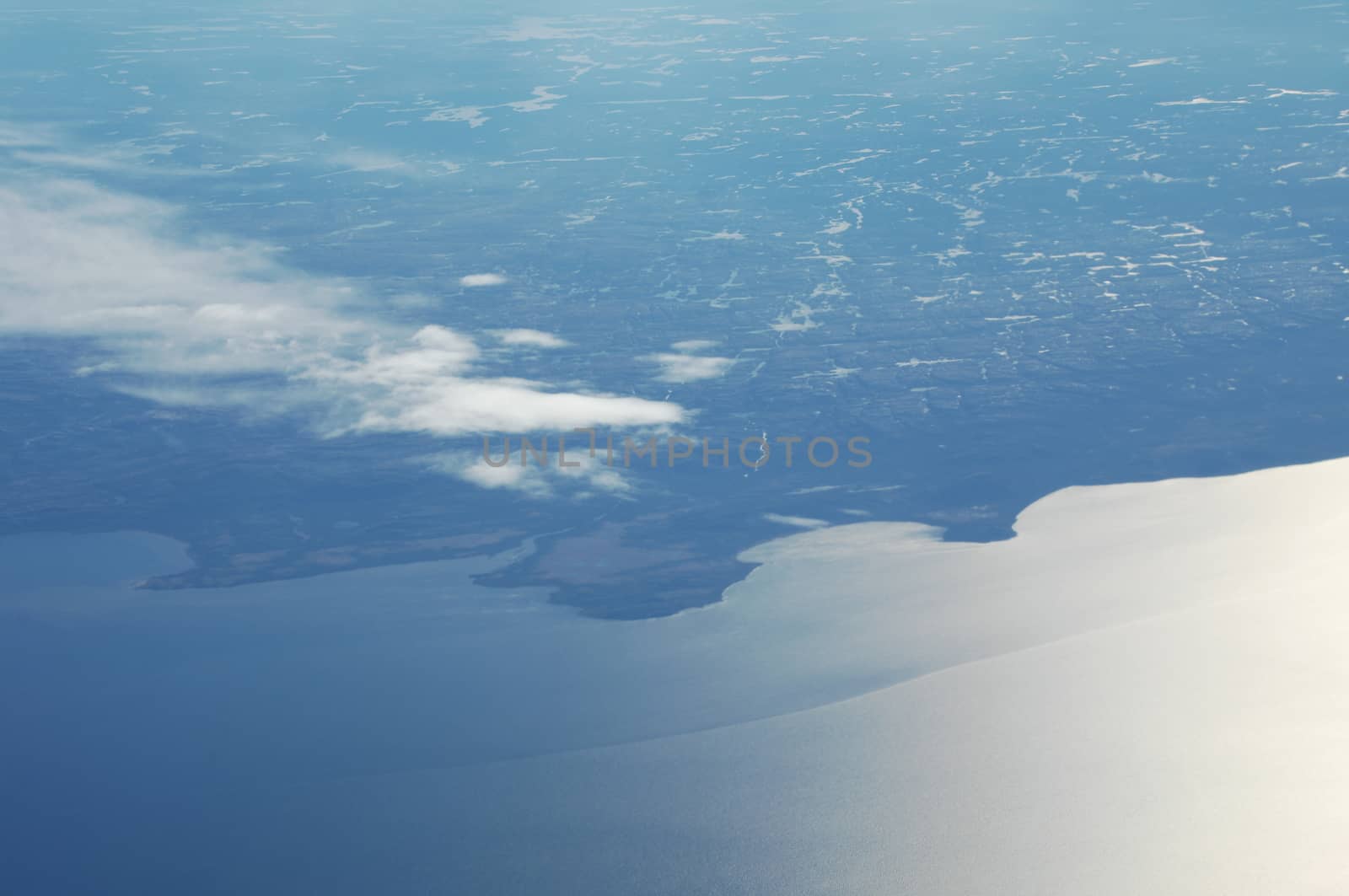 Aerial view of Clouds through flight window