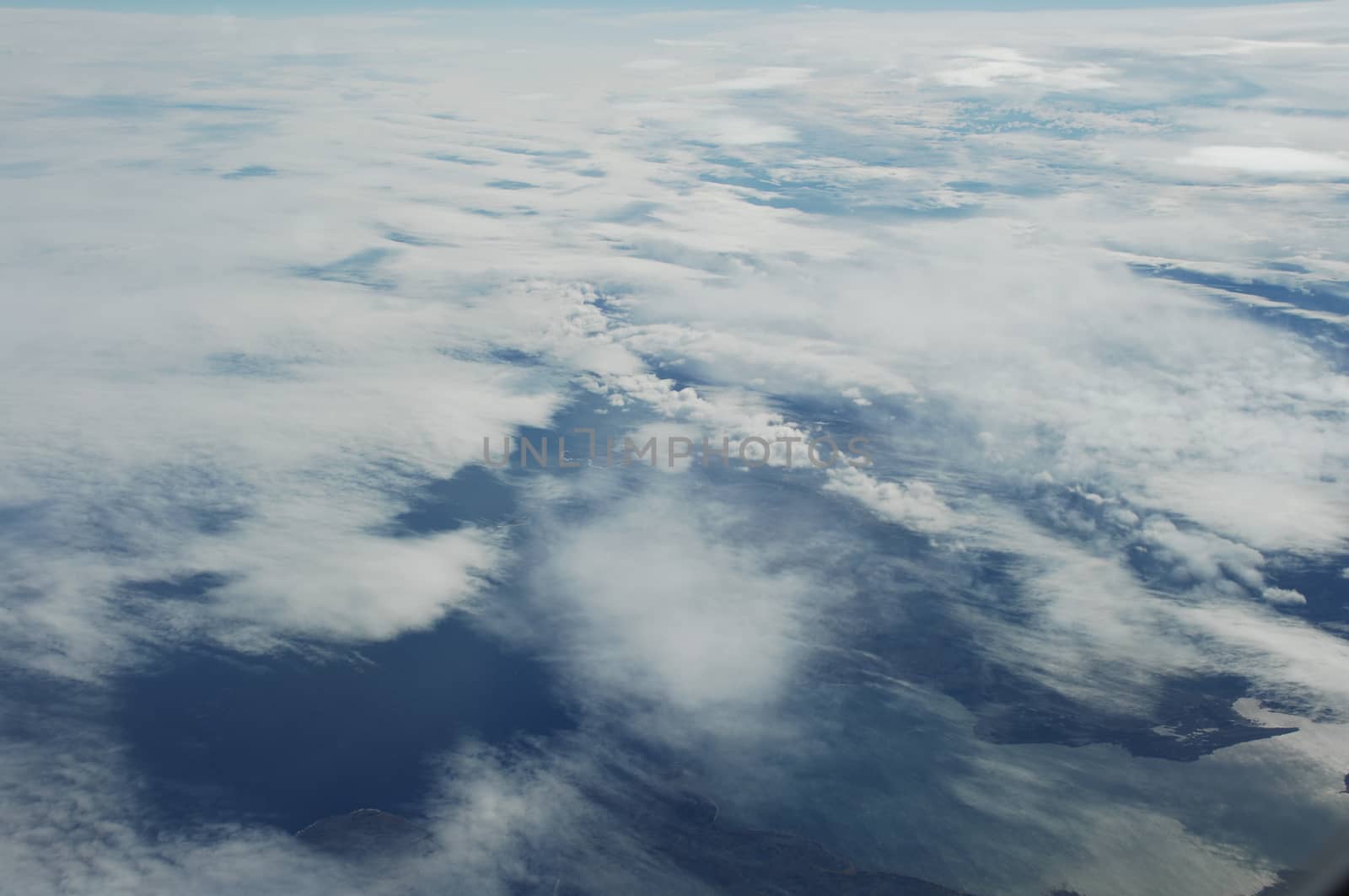 Aerial view of Clouds through flight window