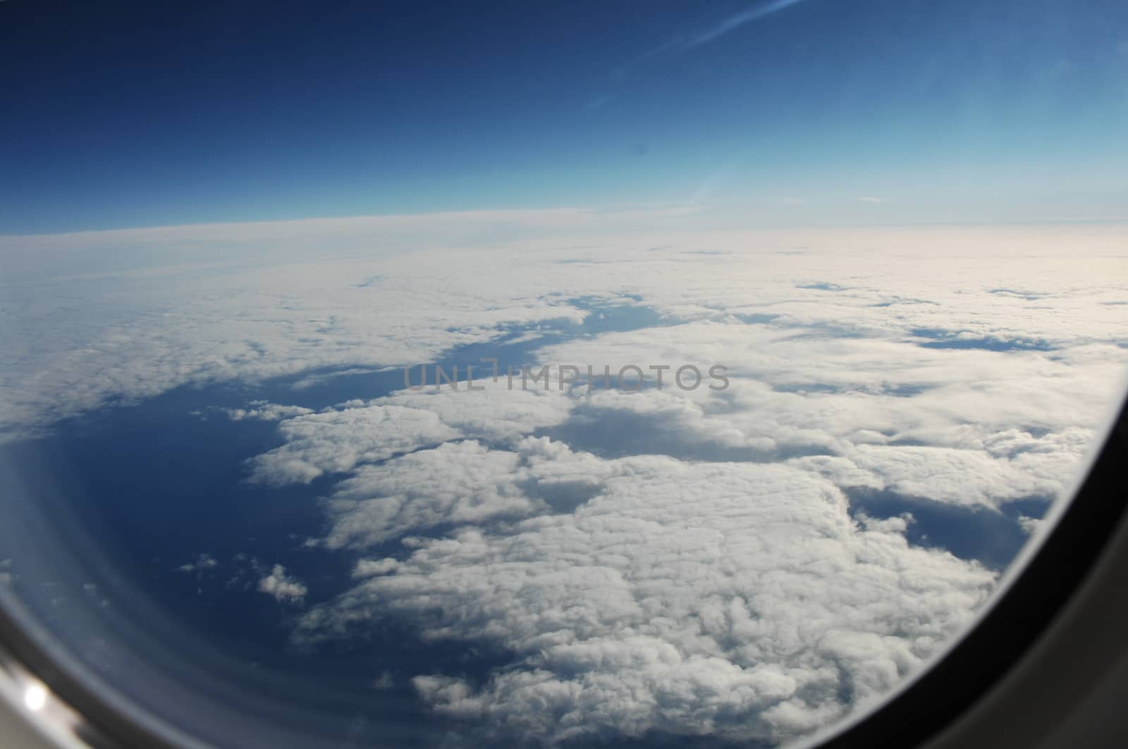 Aerial view of Clouds through flight window