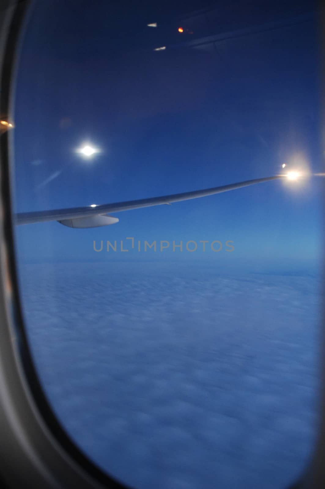 Aerial view of Clouds through flight window