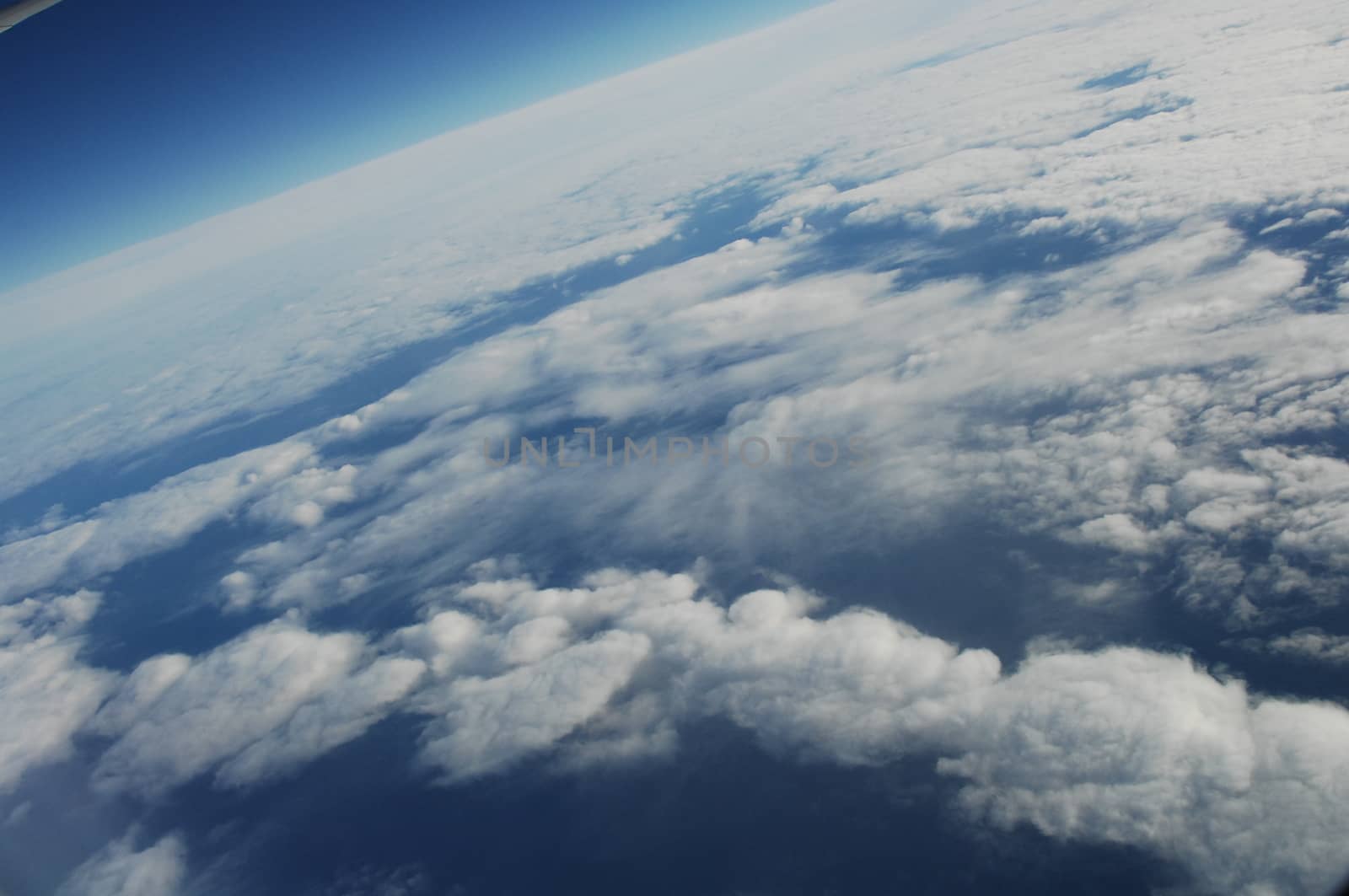 Aerial view of Clouds through flight window