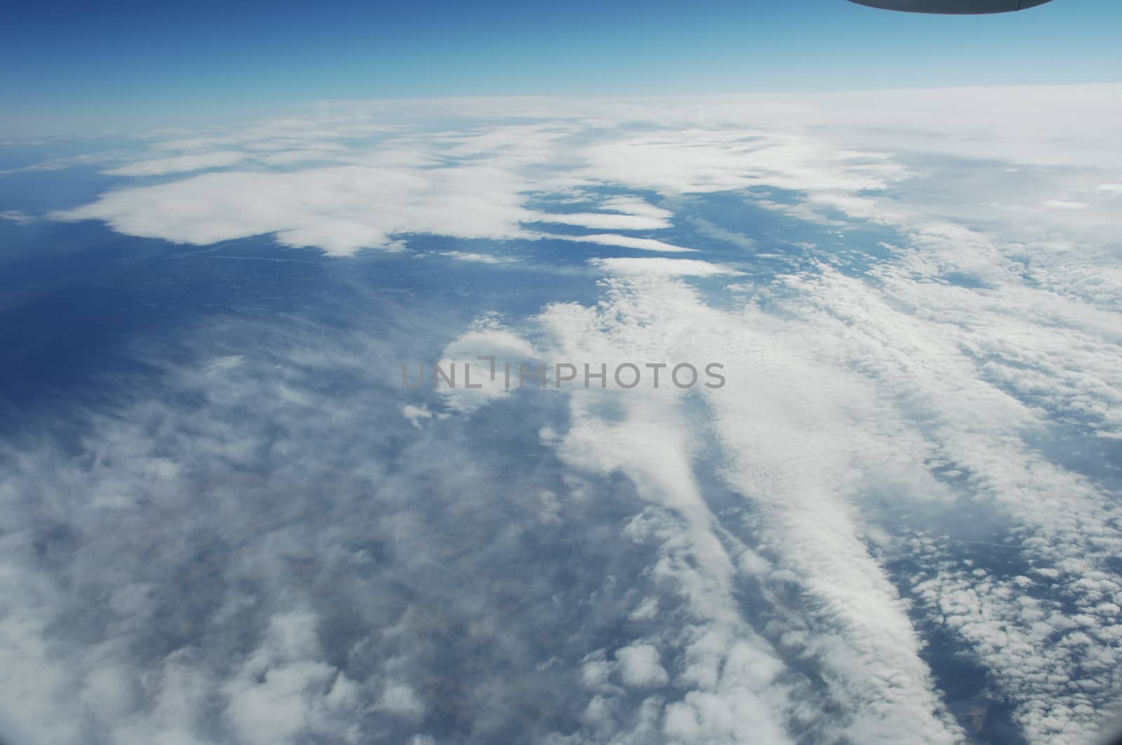 Aerial view of Clouds through flight window