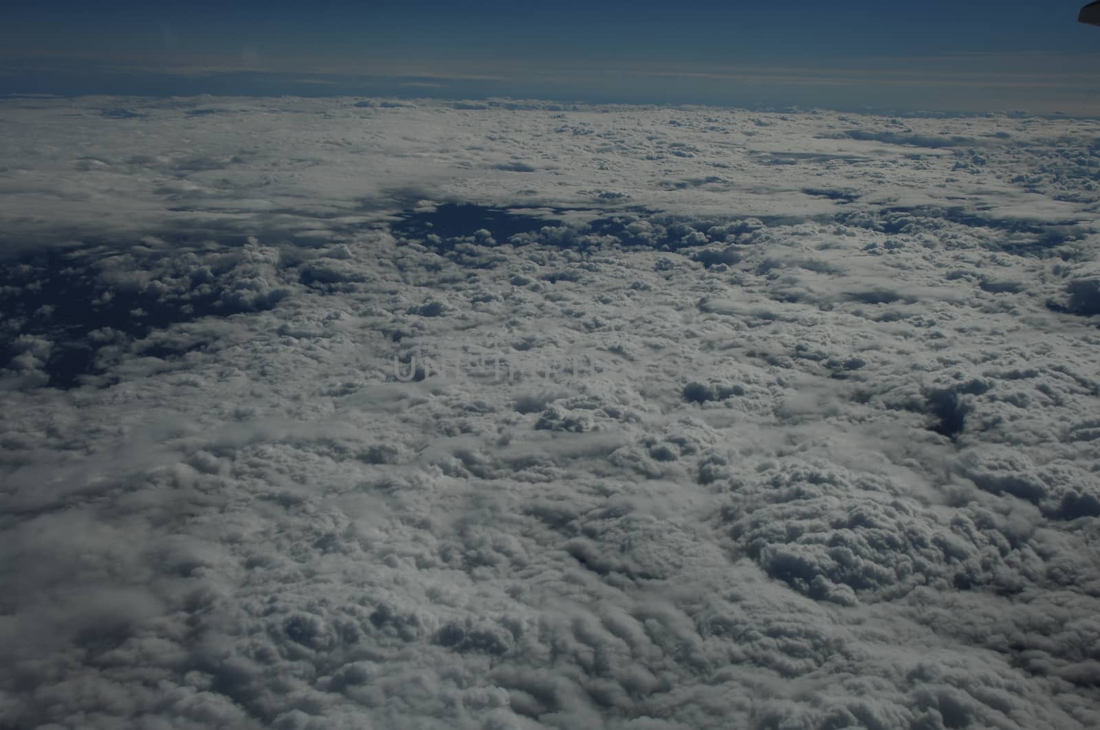 Aerial view of Clouds through flight window