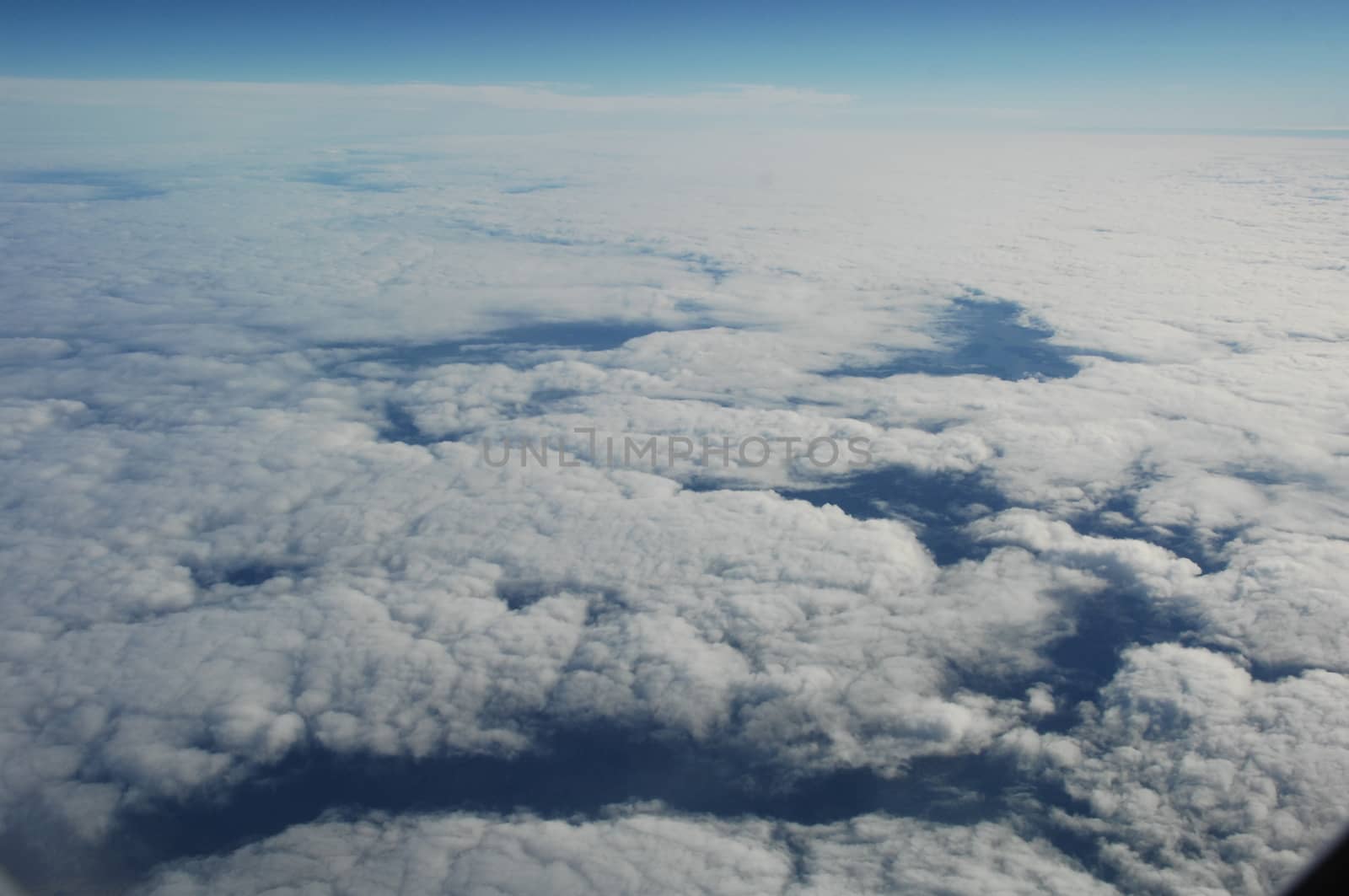 Aerial view of Clouds through flight window