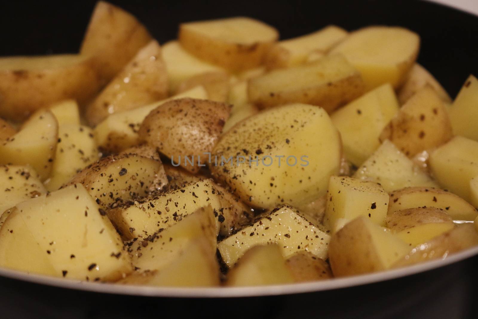 Frying potatoes in pan with oil. by mynewturtle1