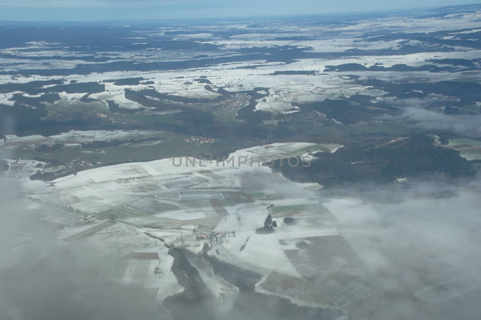 Aerial view of Clouds through flight window