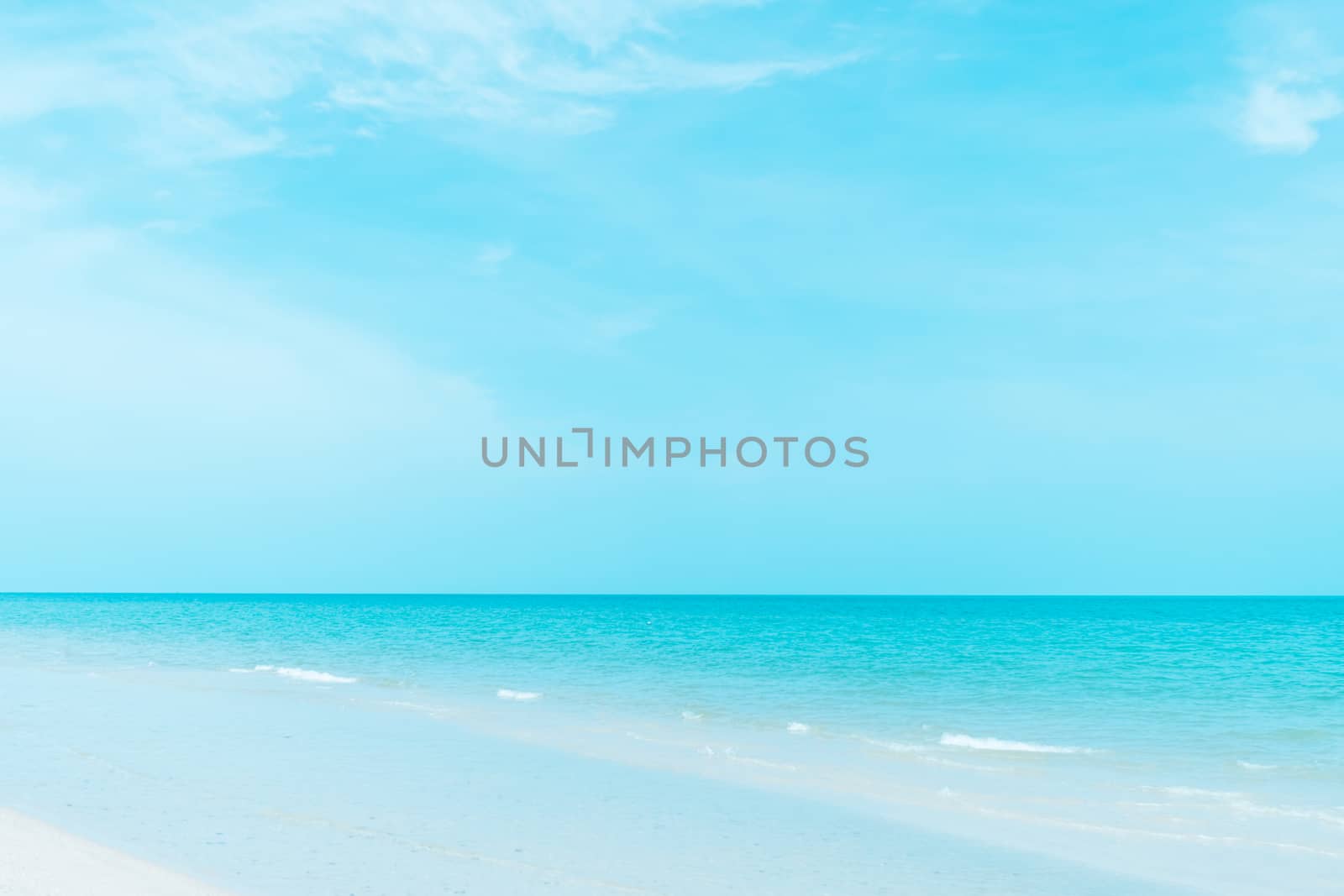 Tropical nature clean beach and white sand in summer with sun light blue sky and bokeh abstract  background.