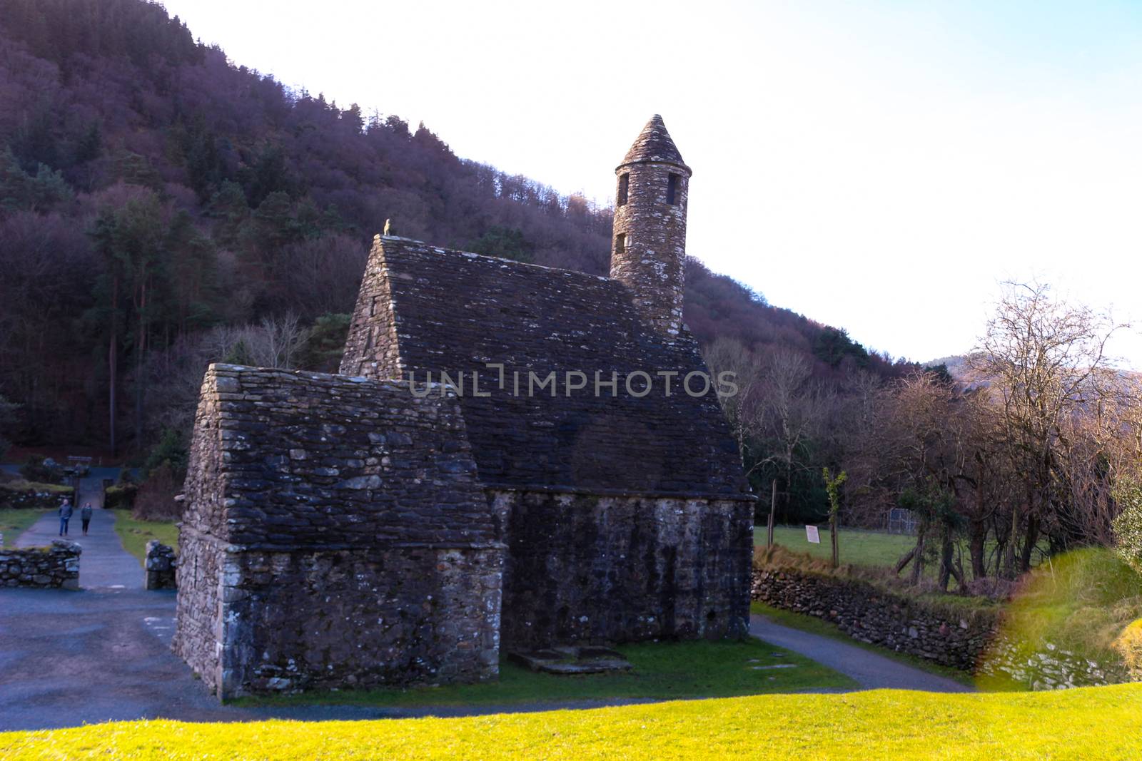 GLENDALOUGH, IRELAND - February 20 2018: The ancient cemetery in monastic site Glendalough. Glendalough Valley, Wicklow Mountains National Park, Ireland. Glendalough is home to one of the most important monastic sites in Ireland. This early Christian monastic settlement was founded by St. Kevin in the 6th century and from this developed the 'Monastic City'.