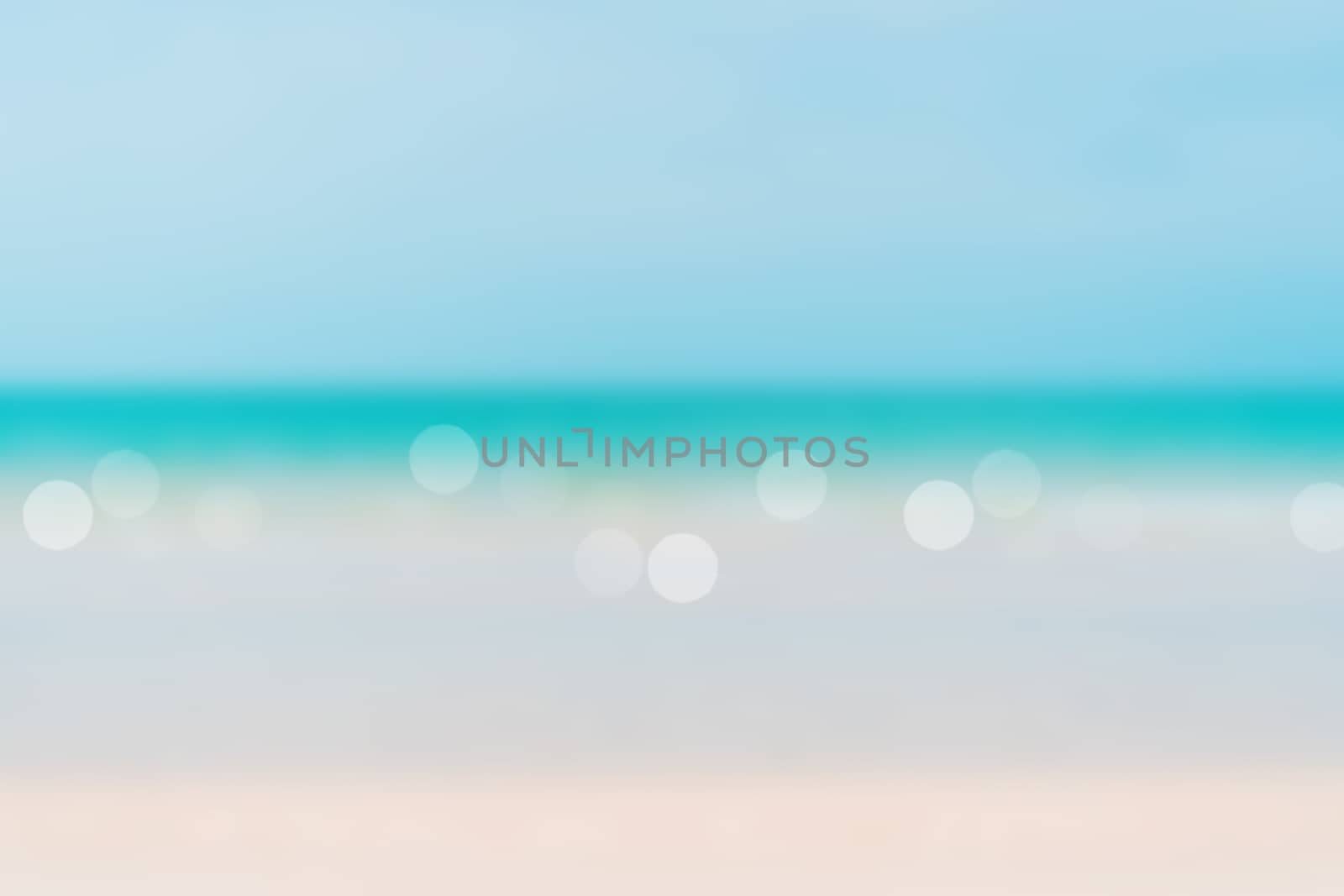 Blur summer bokeh beach with sun light and blue sky background.