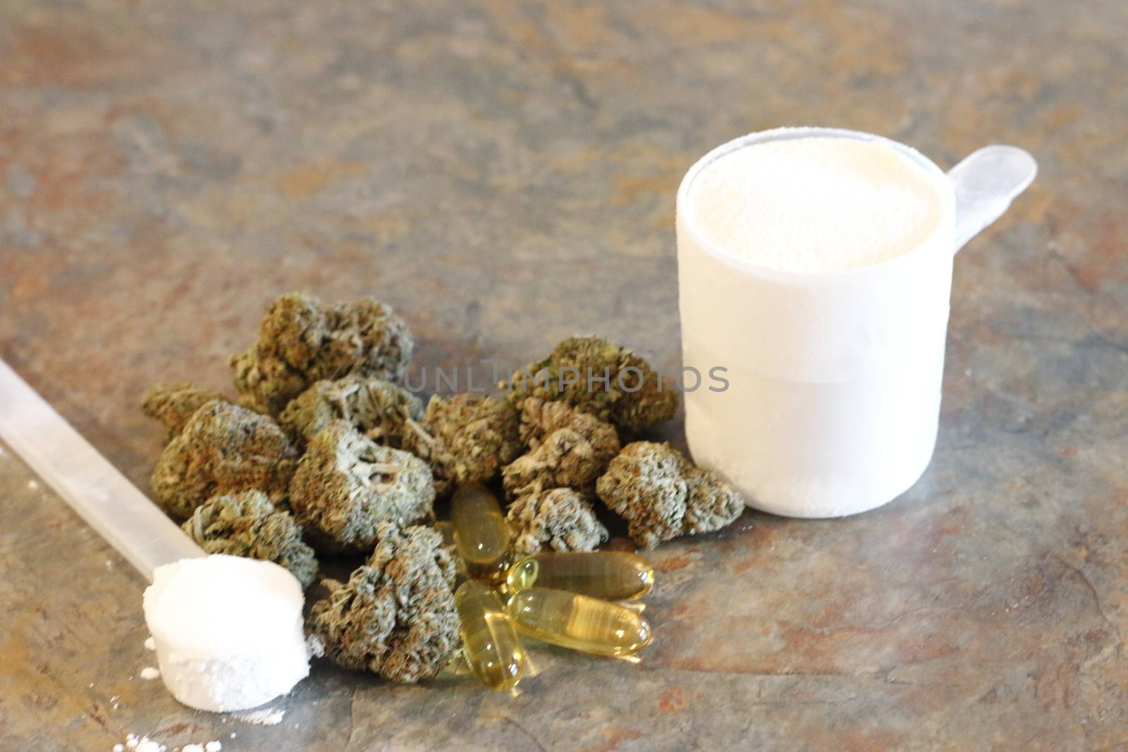 marijuana with various bodybuilding supplements on granite tabletop by mynewturtle1