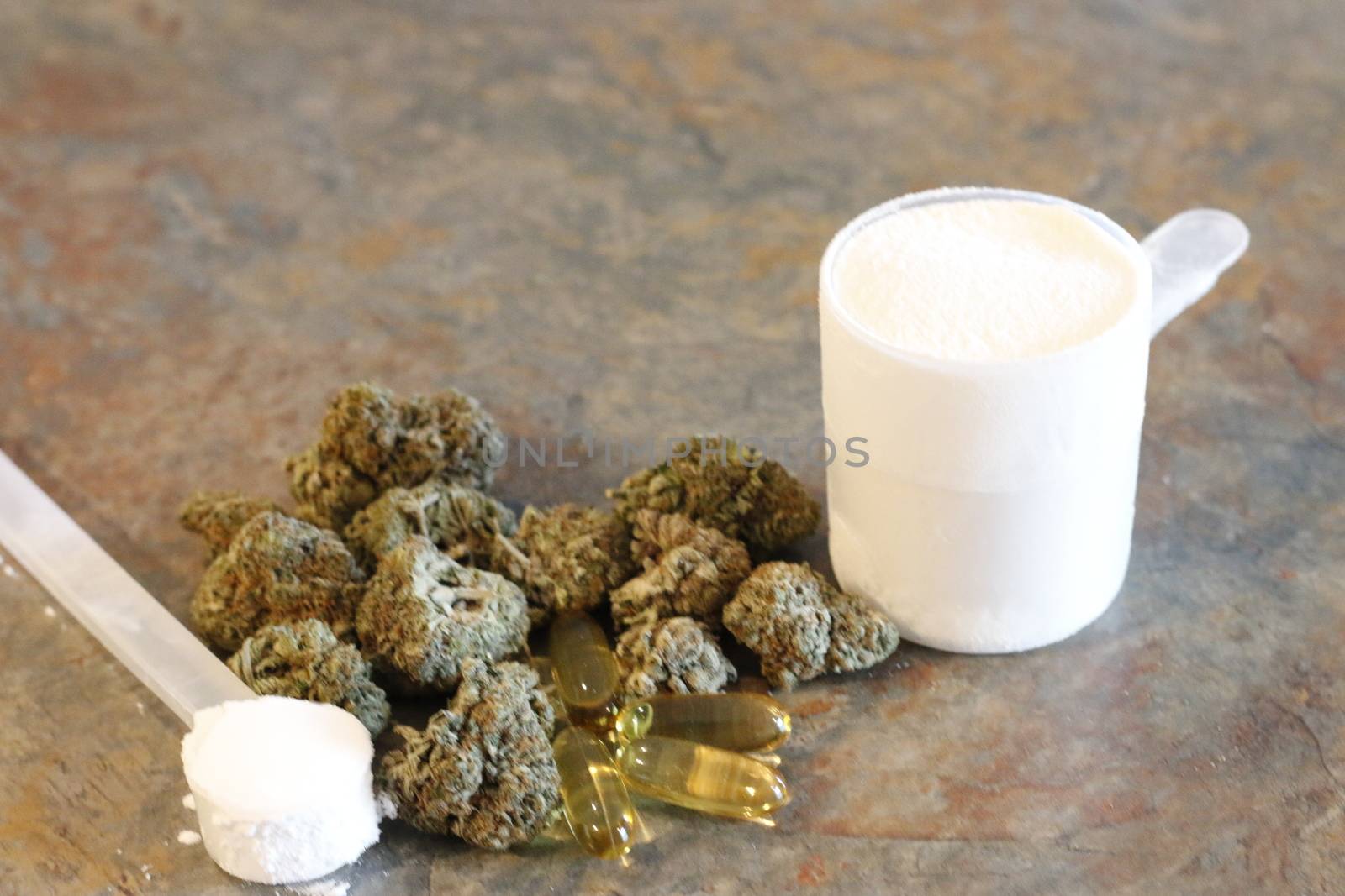 marijuana with various bodybuilding supplements on granite tabletop by mynewturtle1