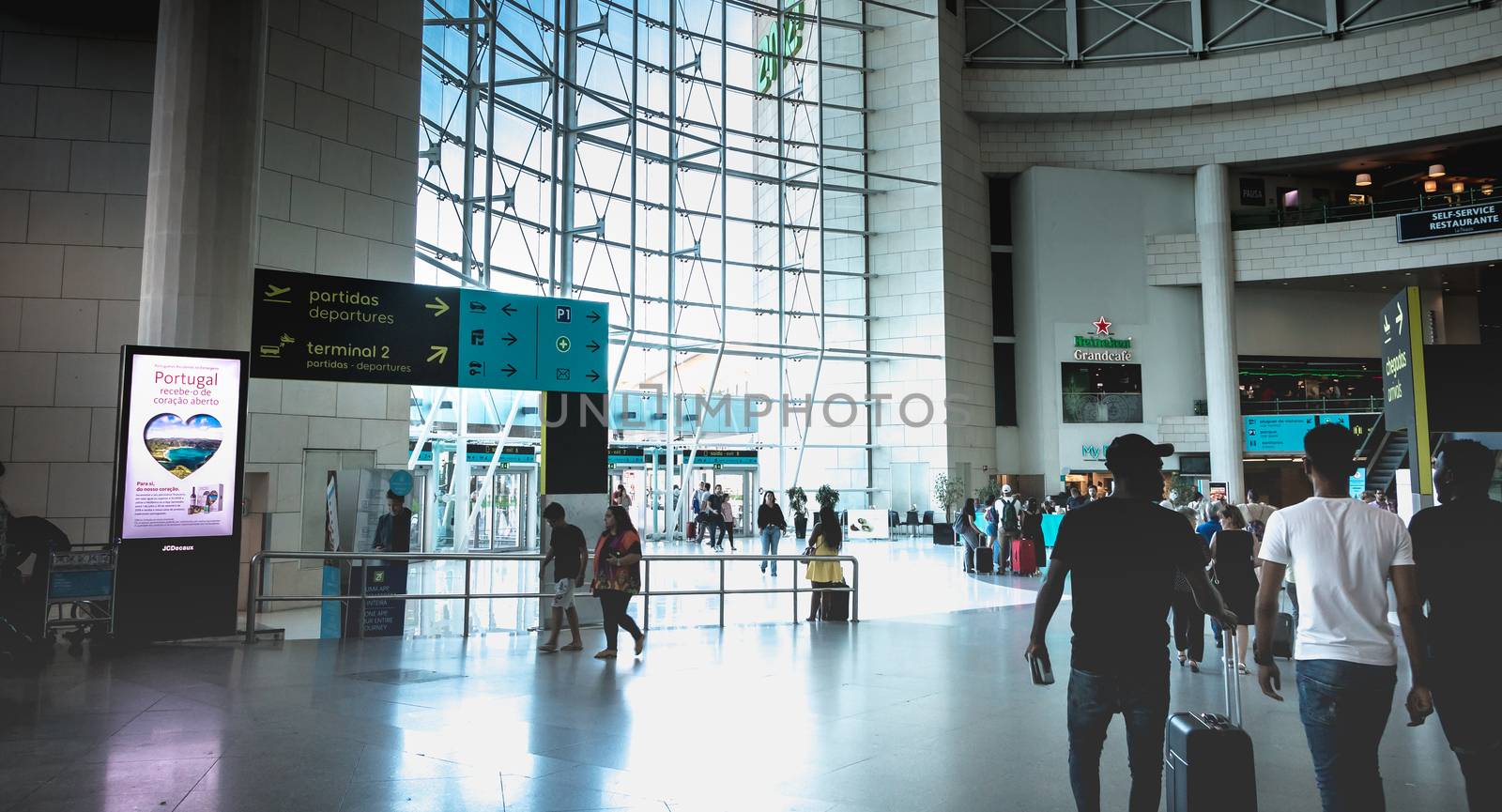 Interior view of Lisbon International Airport where travelers wa by AtlanticEUROSTOXX