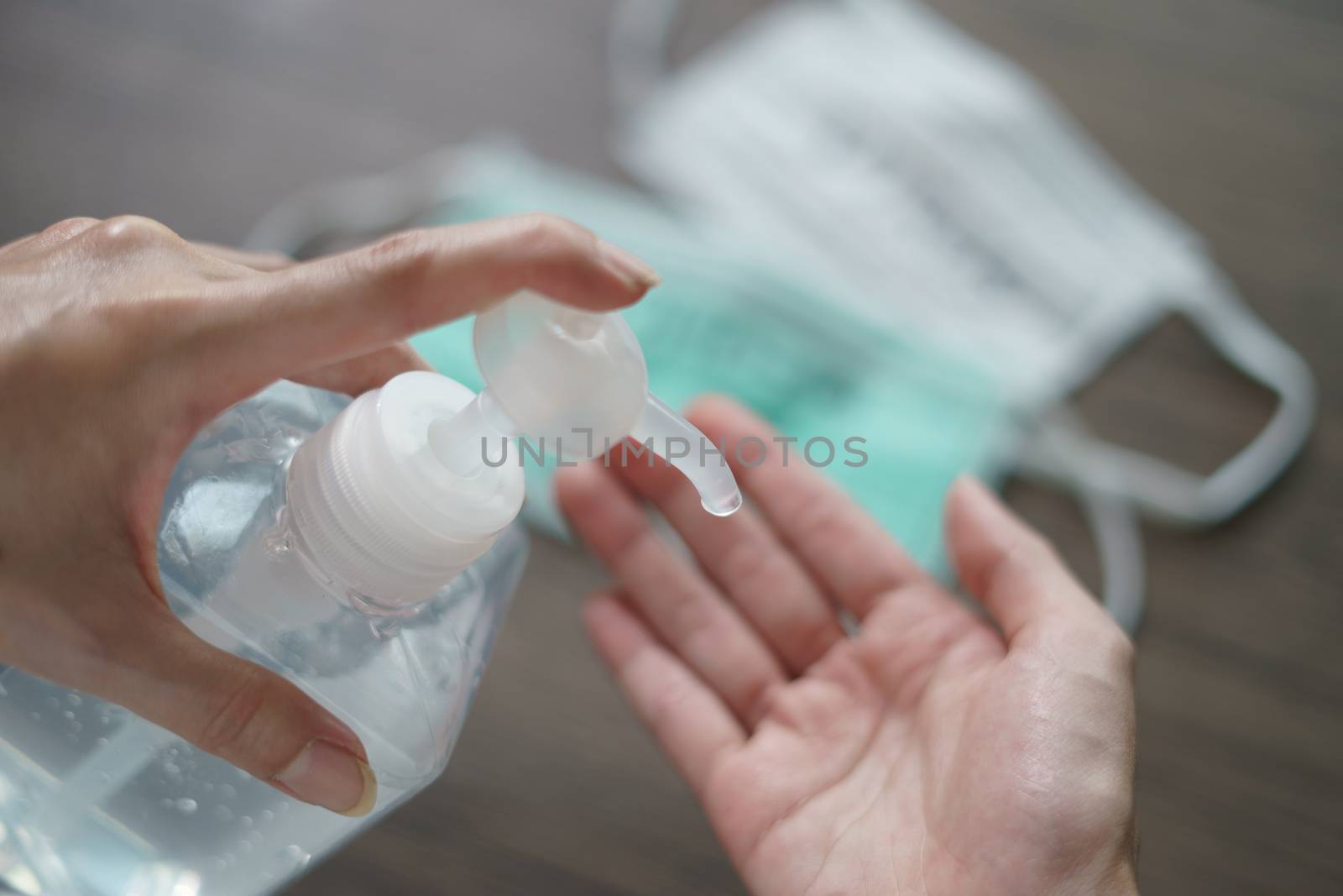 Woman washing hands with alcohol gel or sanitizer gel. corona vi by sirawit99