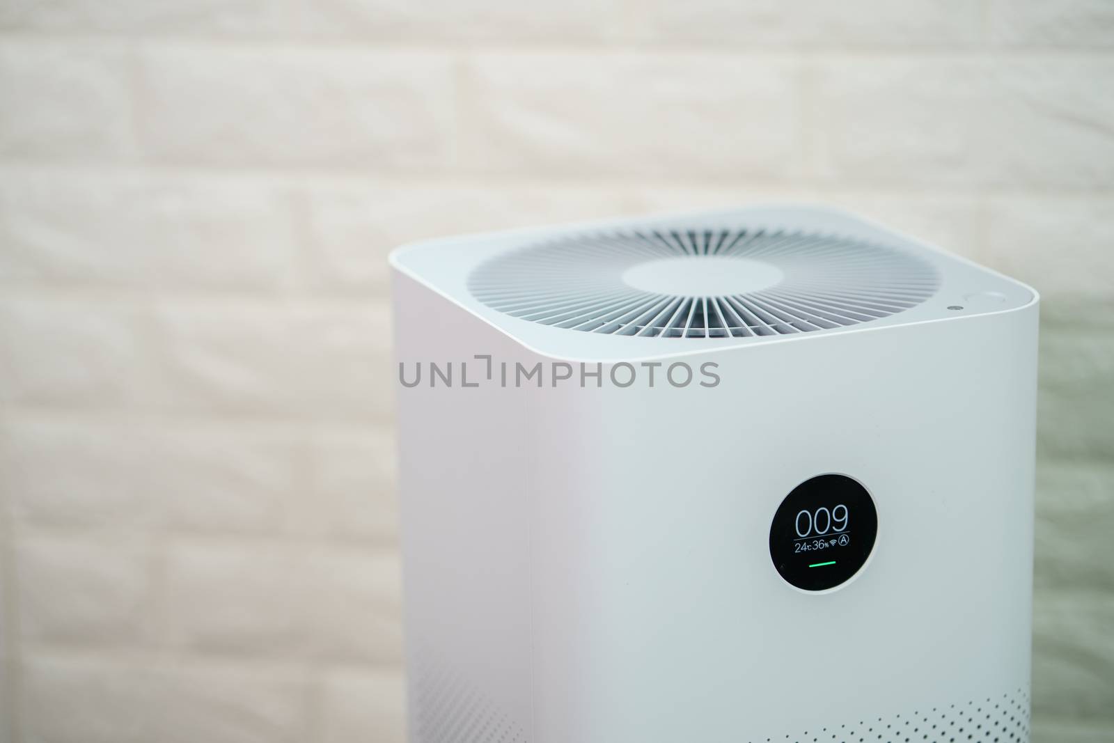 Closeup of Air purifier with monitor screen, show air quality in the room. PM2.5 concept.